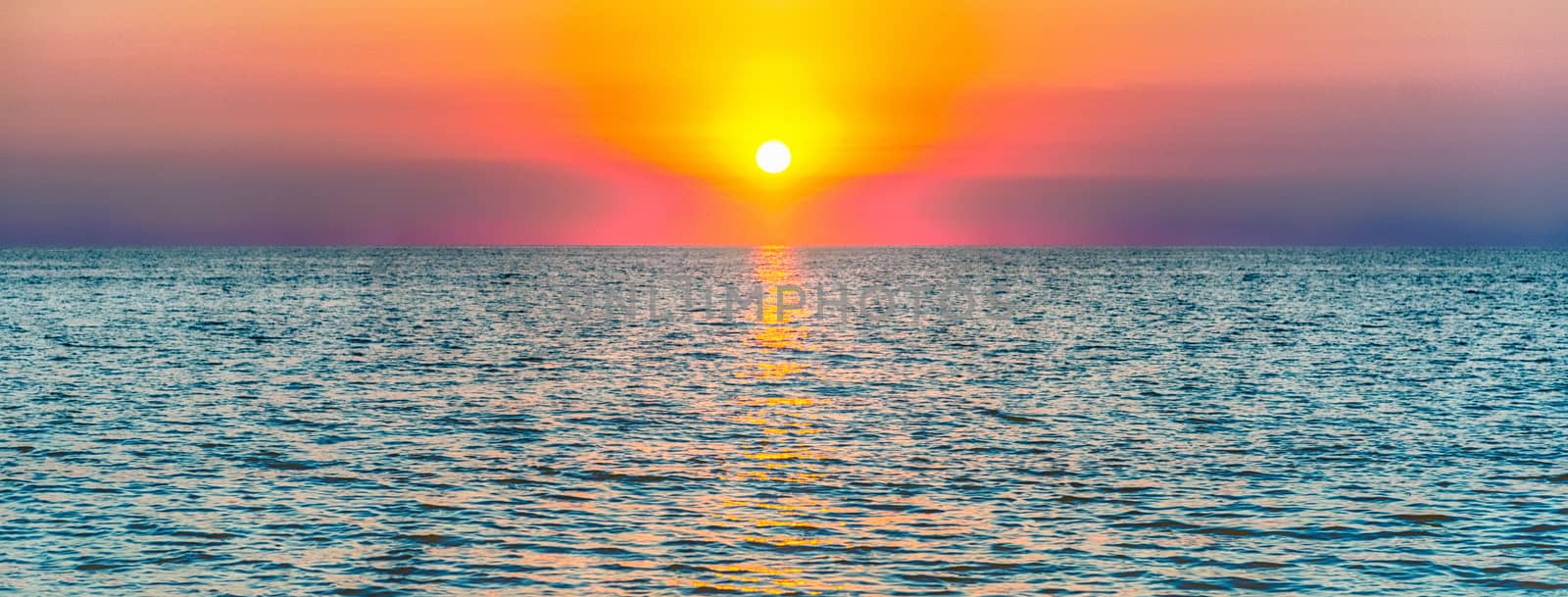 Scenic sunset on the mediterranean sea at the end of summer