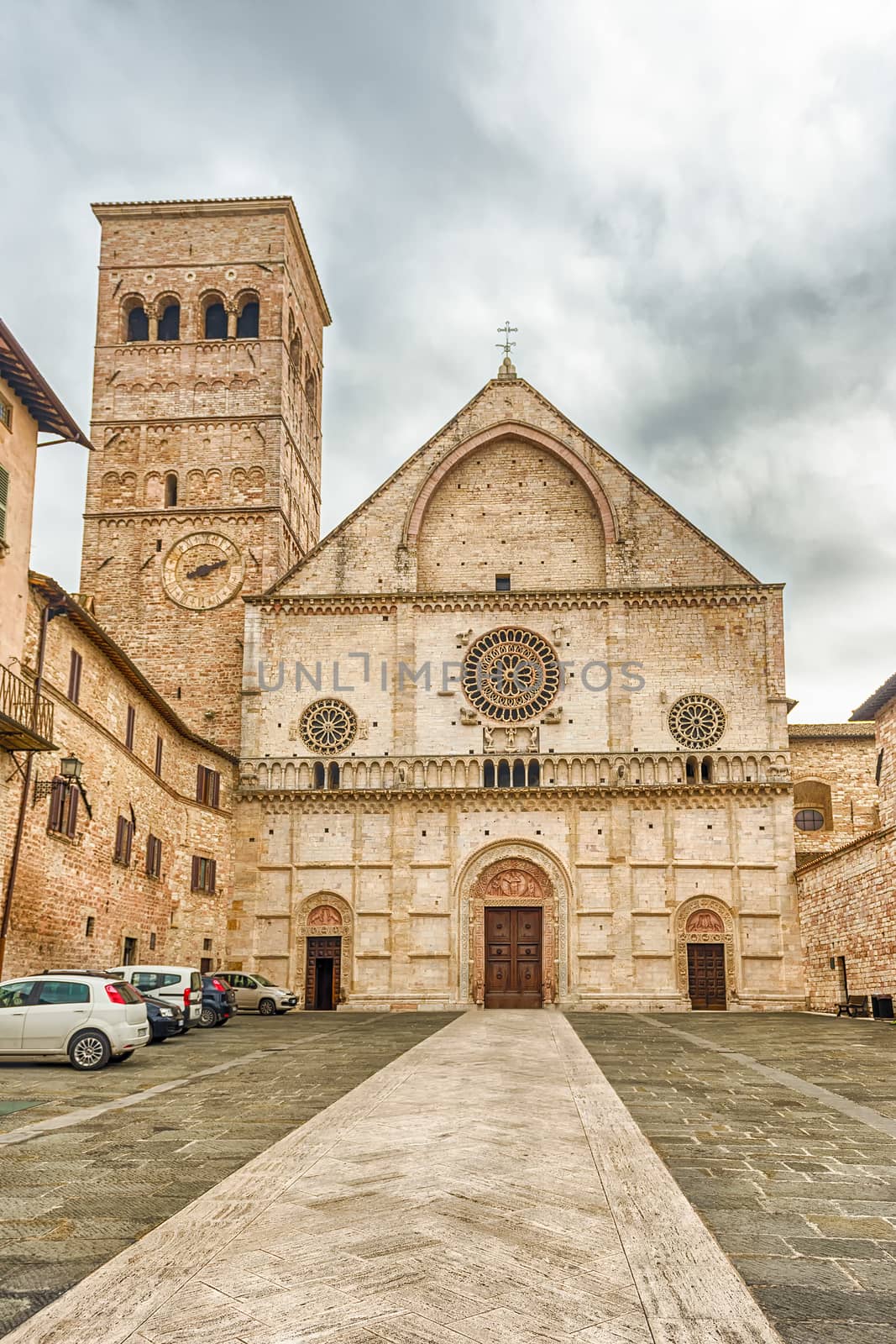 Exterior view with facade of the medieval Cathedral of Assisi, Italy. The church is dedicated to San Rufino