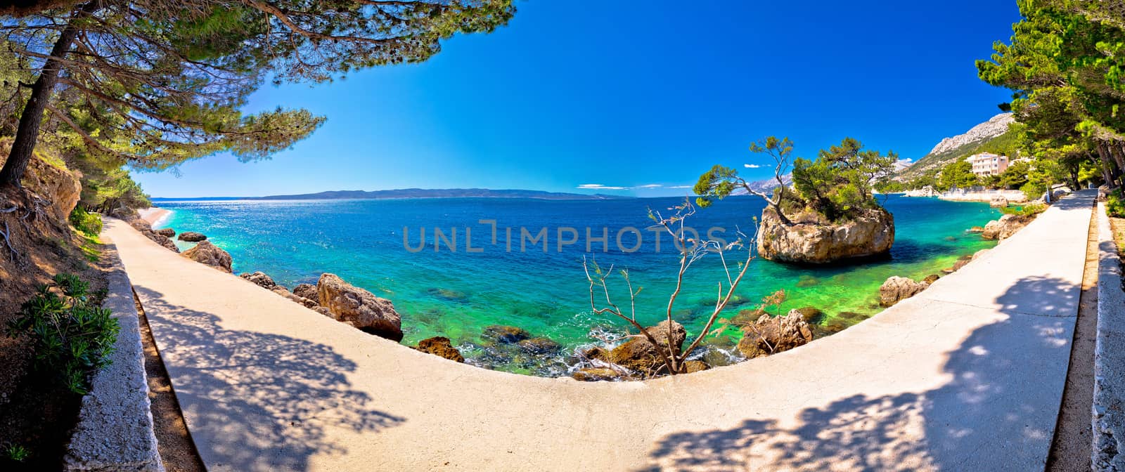 Idyllic islet on Punta Rata beach in Brela panoramic view by xbrchx