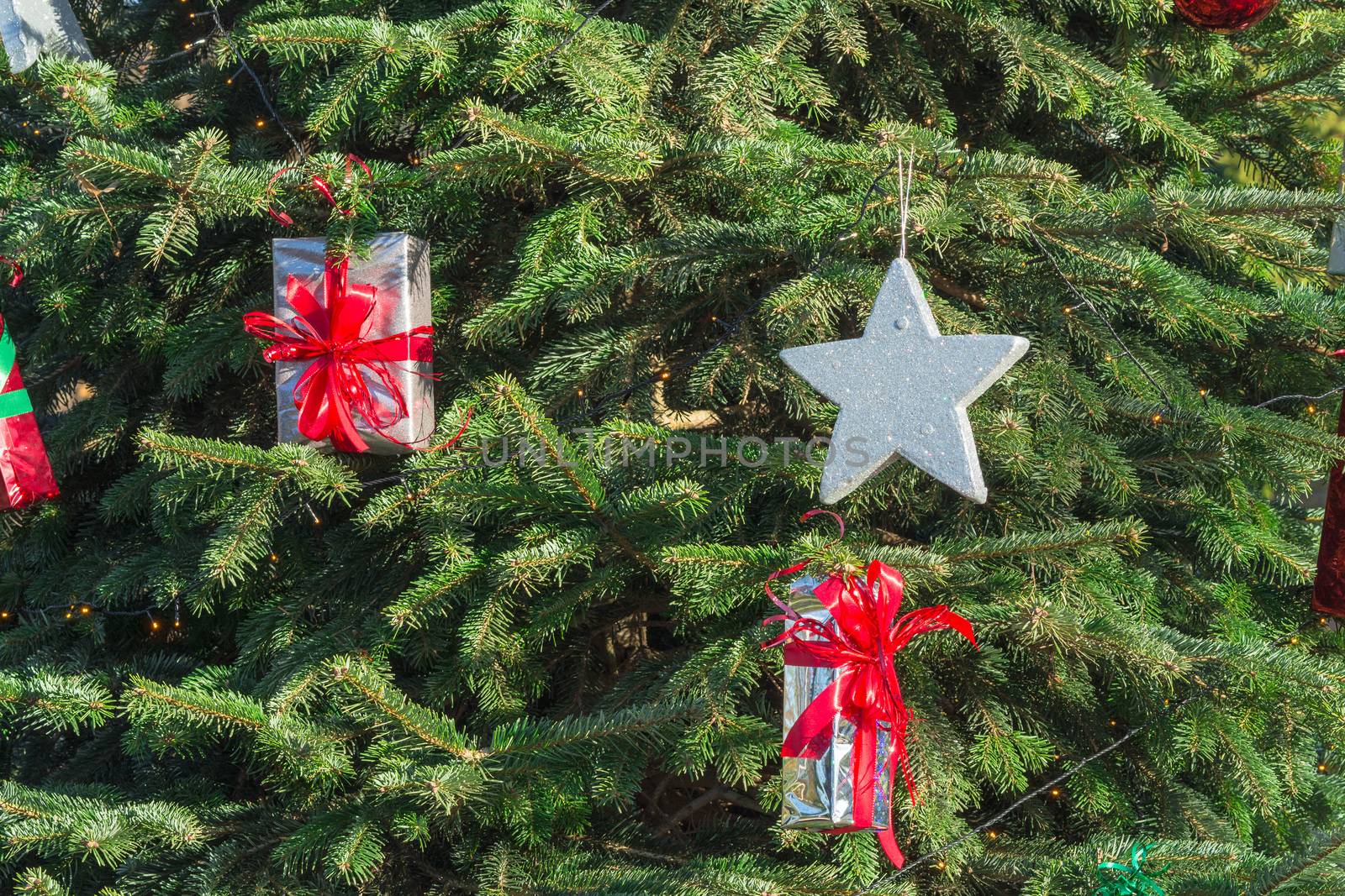 Beautiful christmas tree with gift boxes and shopping bags 