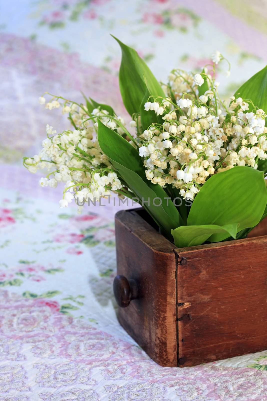Bouquet of Lilies of the Valley in wooden box