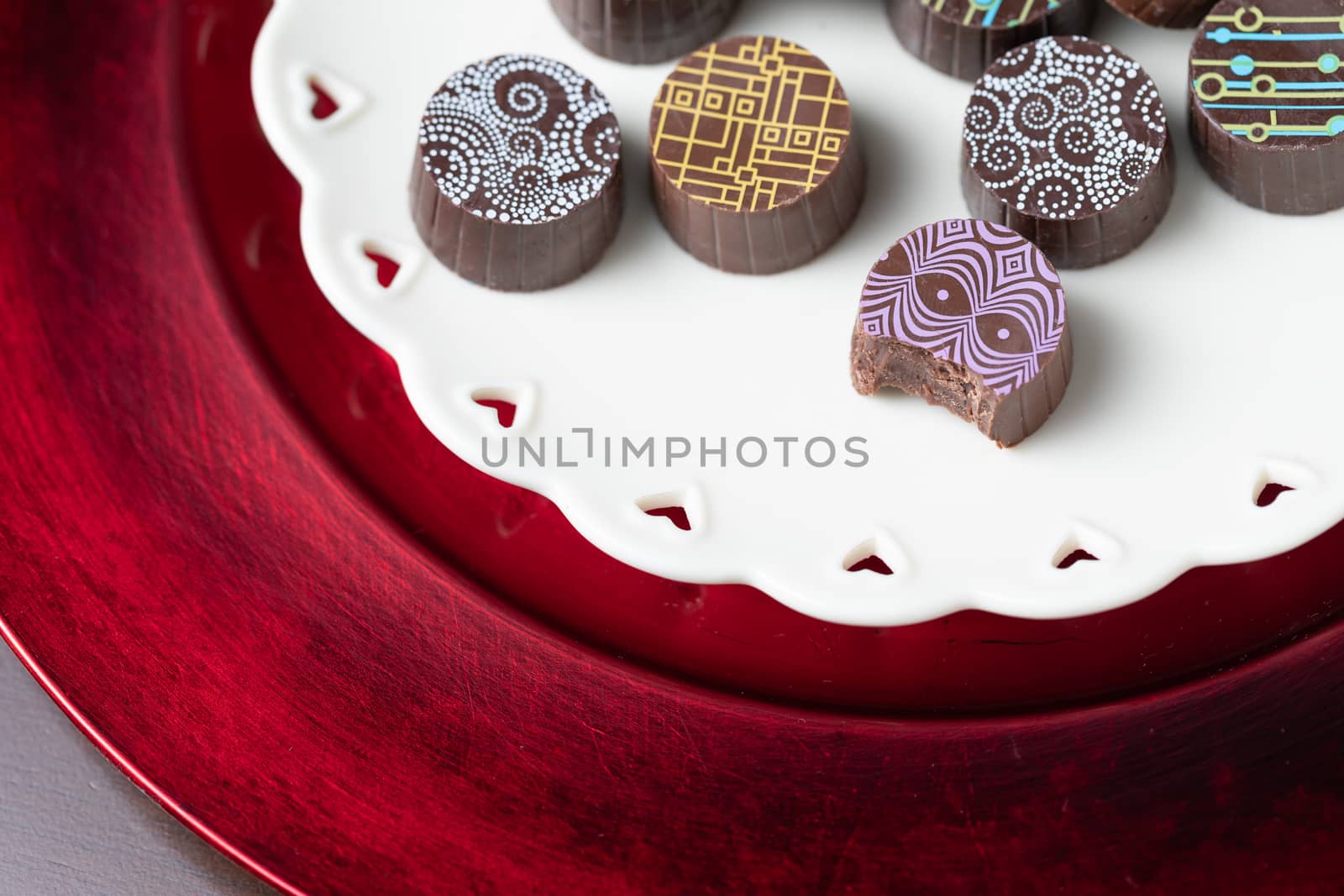 Artisan Fine Chocolate Candy On Serving Dish with Heart Design by Feverpitched