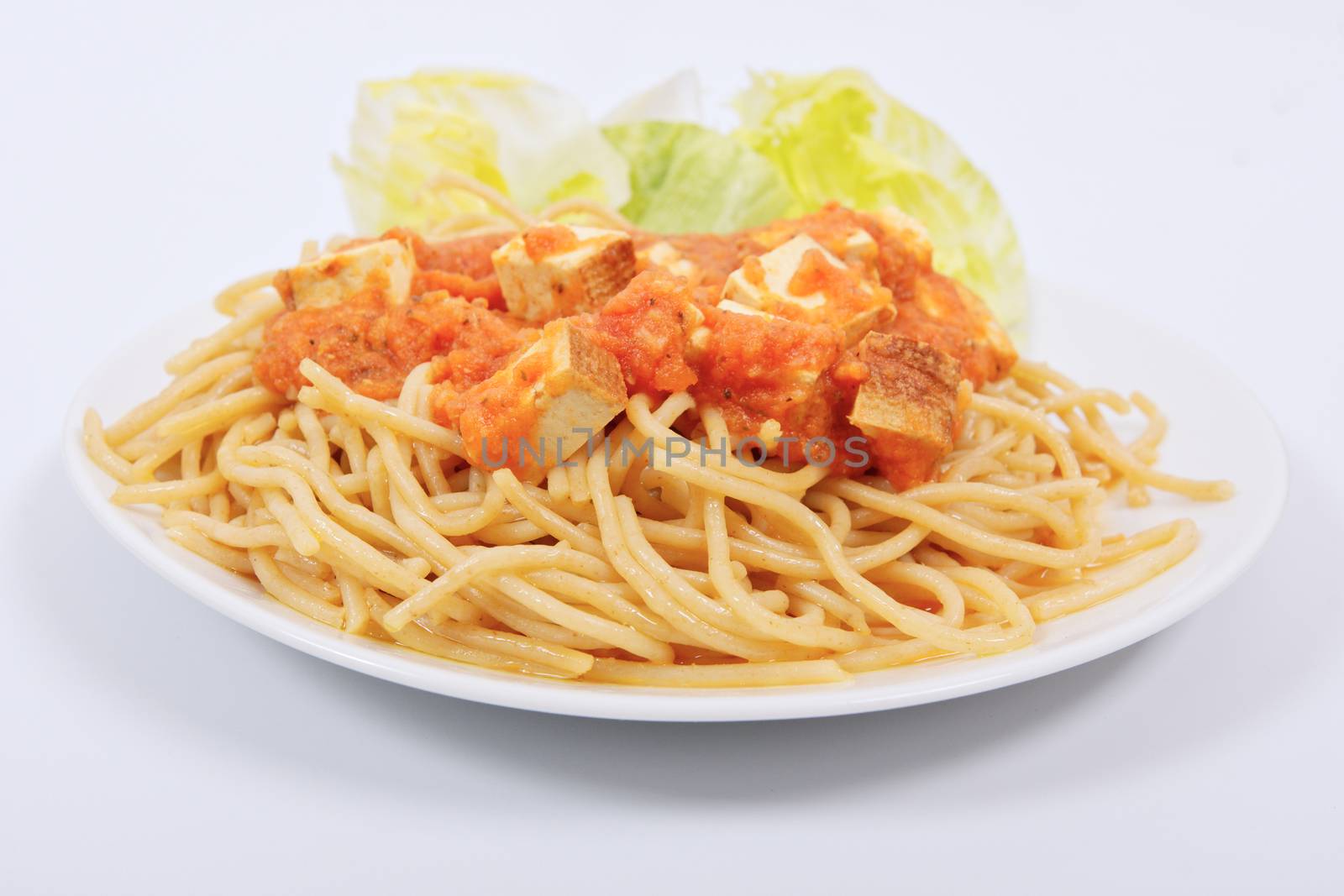 Bolognese spaghetti with tofu on a white background