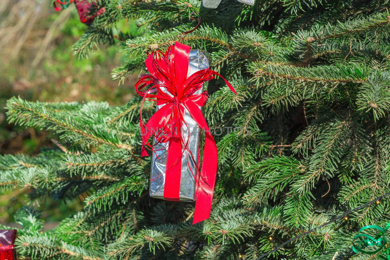 Beautiful christmas tree with gift boxes and shopping bags 