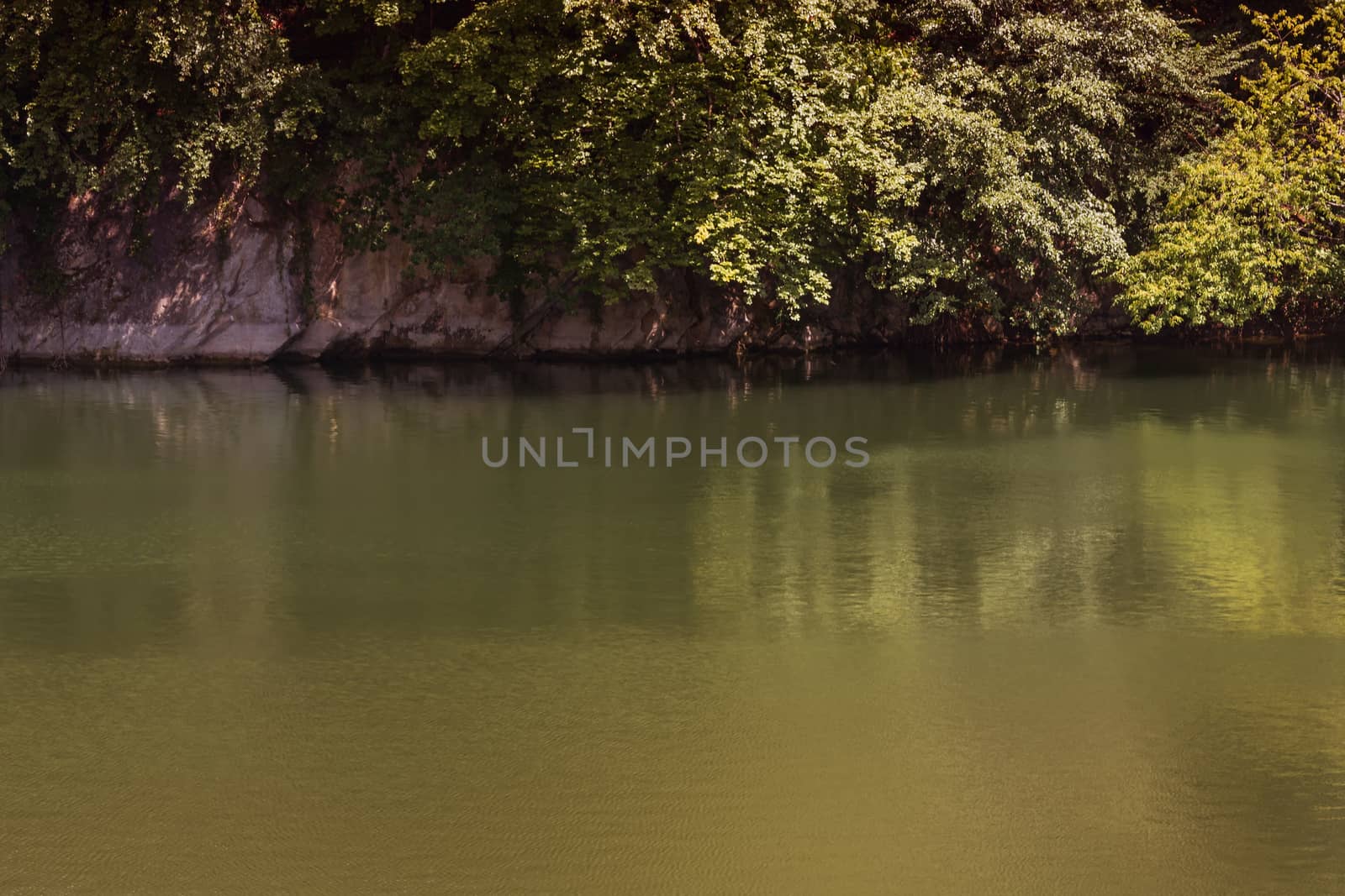 Lake with banks on the site of a former quarry for the extraction of limestone
