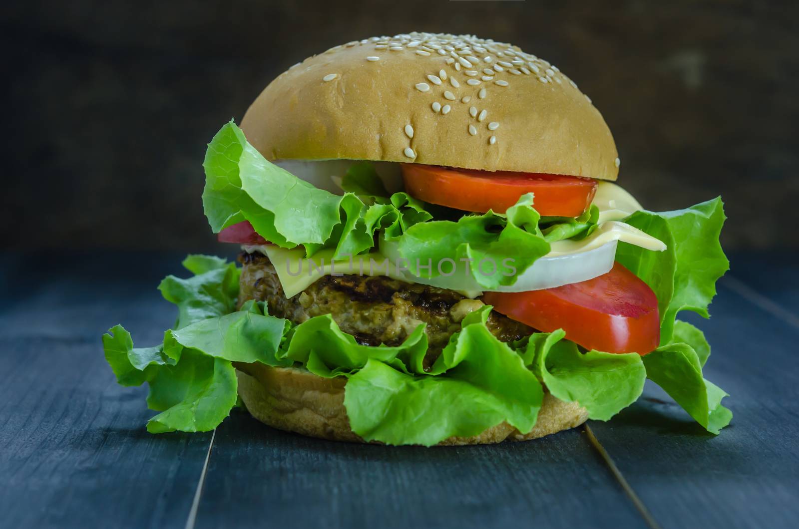 Closeup of home made burgers on wooden background