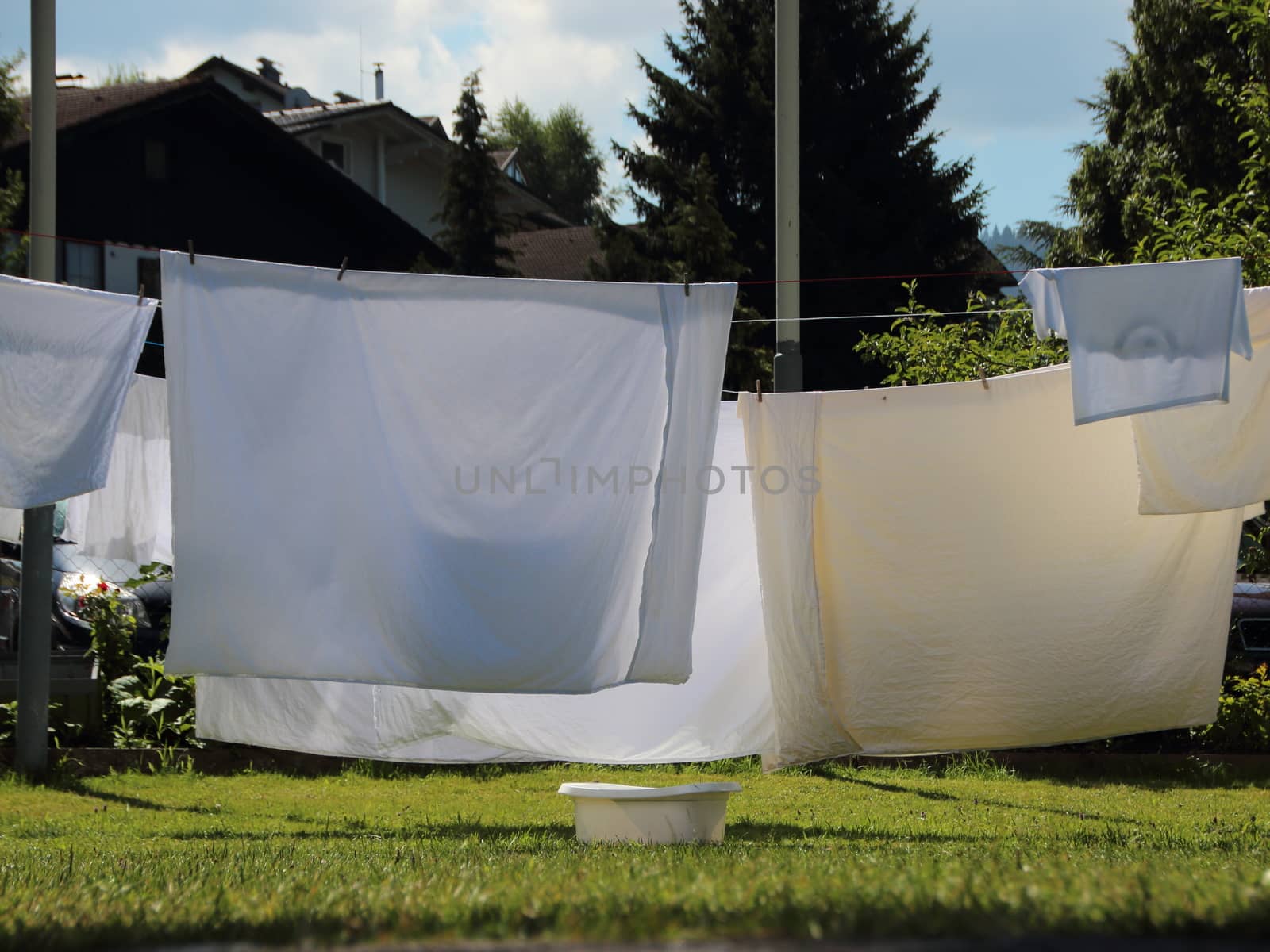 White Laundry Linen Drying in the Sun with Backlight