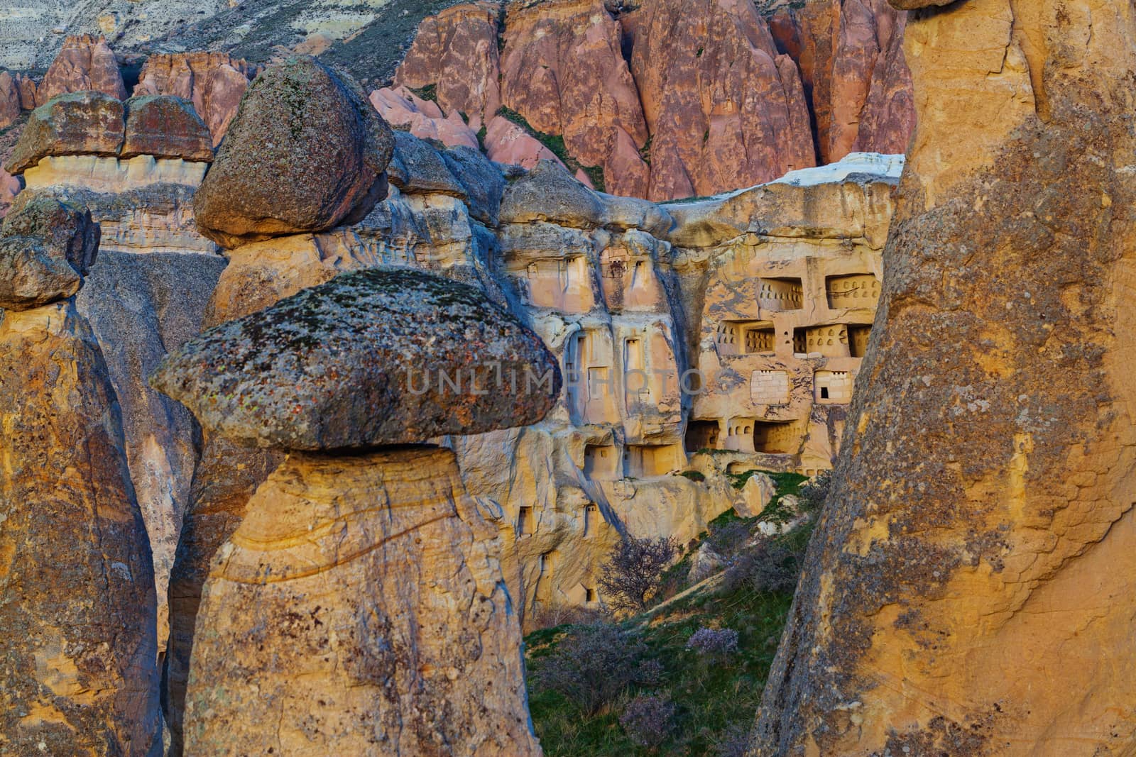 Cylindrical stone cliffs and cave houses near Goreme, Turkey