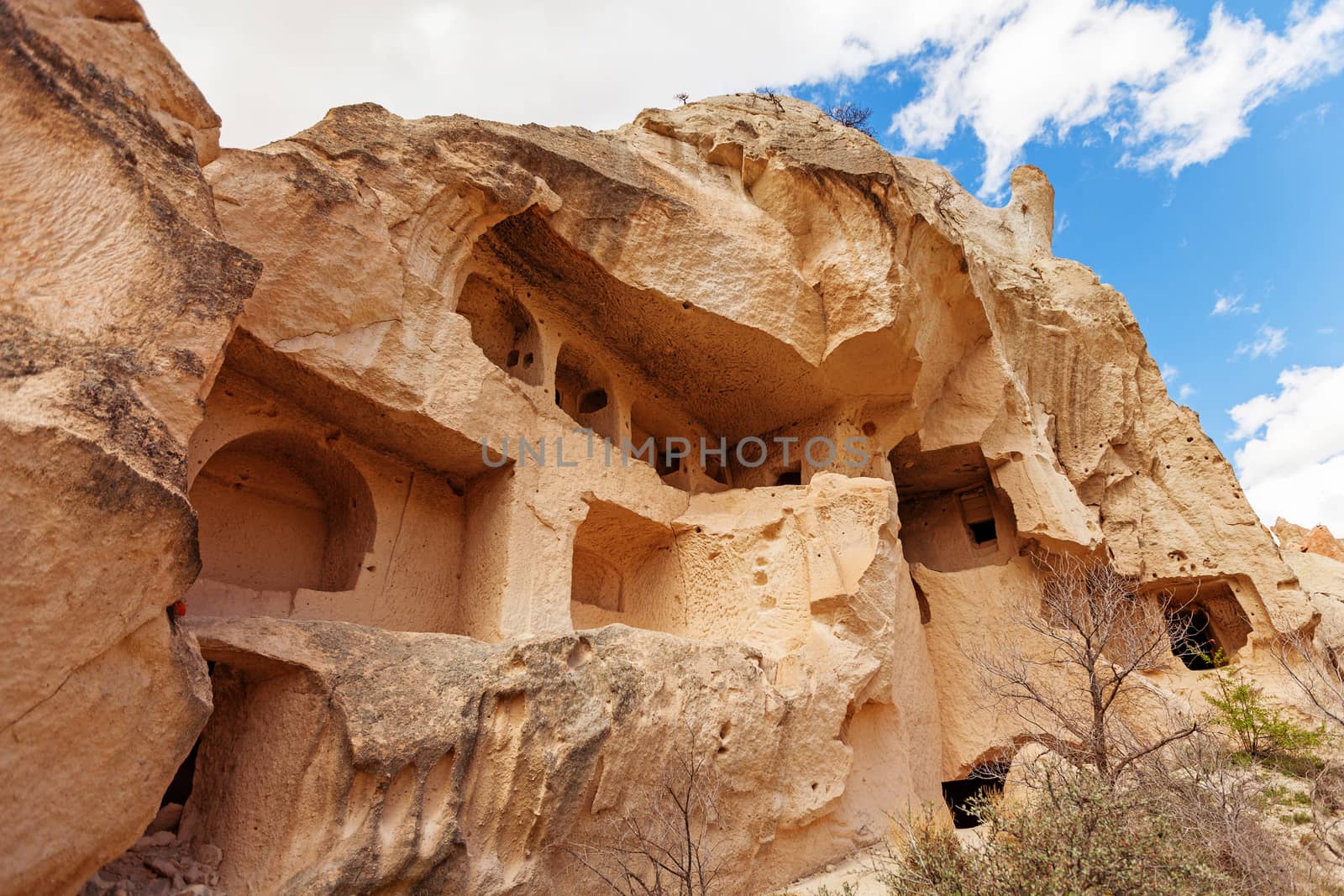 Cylindrical stone cliffs and cave houses near Goreme, Turkey