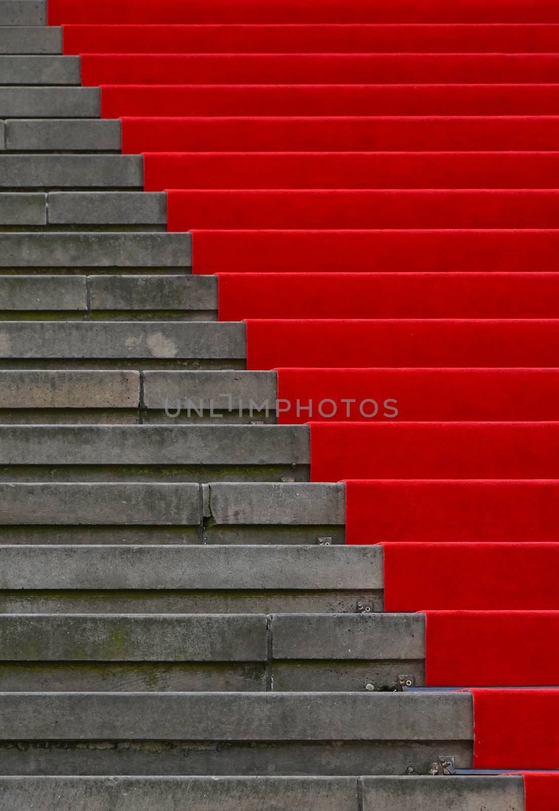 Red carpet over concrete stairs perspective by BreakingTheWalls