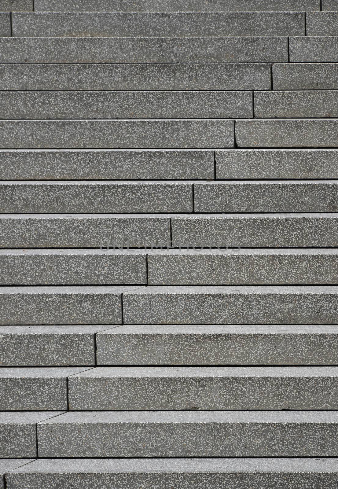 Close up grey concrete stairs perspective ascending, low angle view