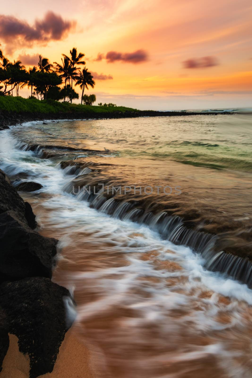 A beautiful sunrise at the beach on the south shore of Kauai, Hawaii.