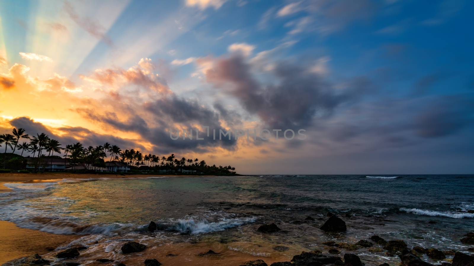 A beautiful sunrise at the beach on the south shore of Kauai, Hawaii.