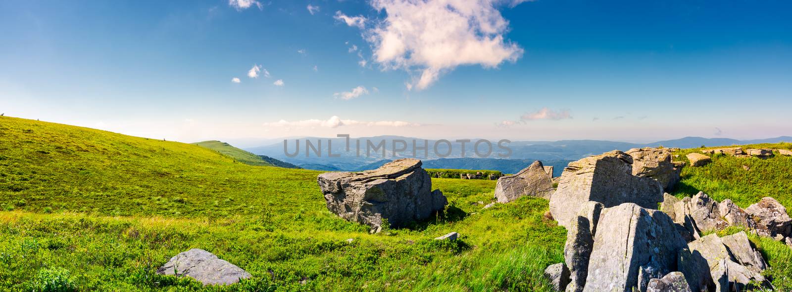 beautiful panorama of Runa mountain in summer. huge rocky formation on the hillside and peak in the distance. wonderful landscape of Carpathians