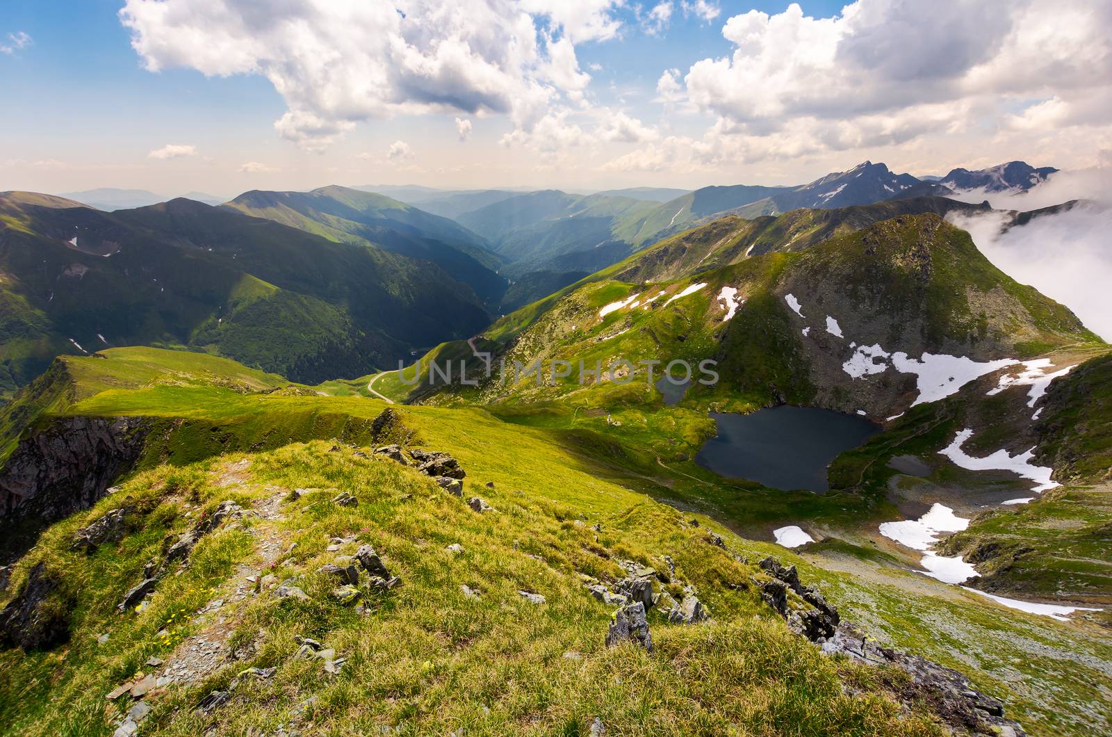 beautiful landscape of Romanian mountains. lovely summer scenery on a cloudy day. Lake Capra down the hillside