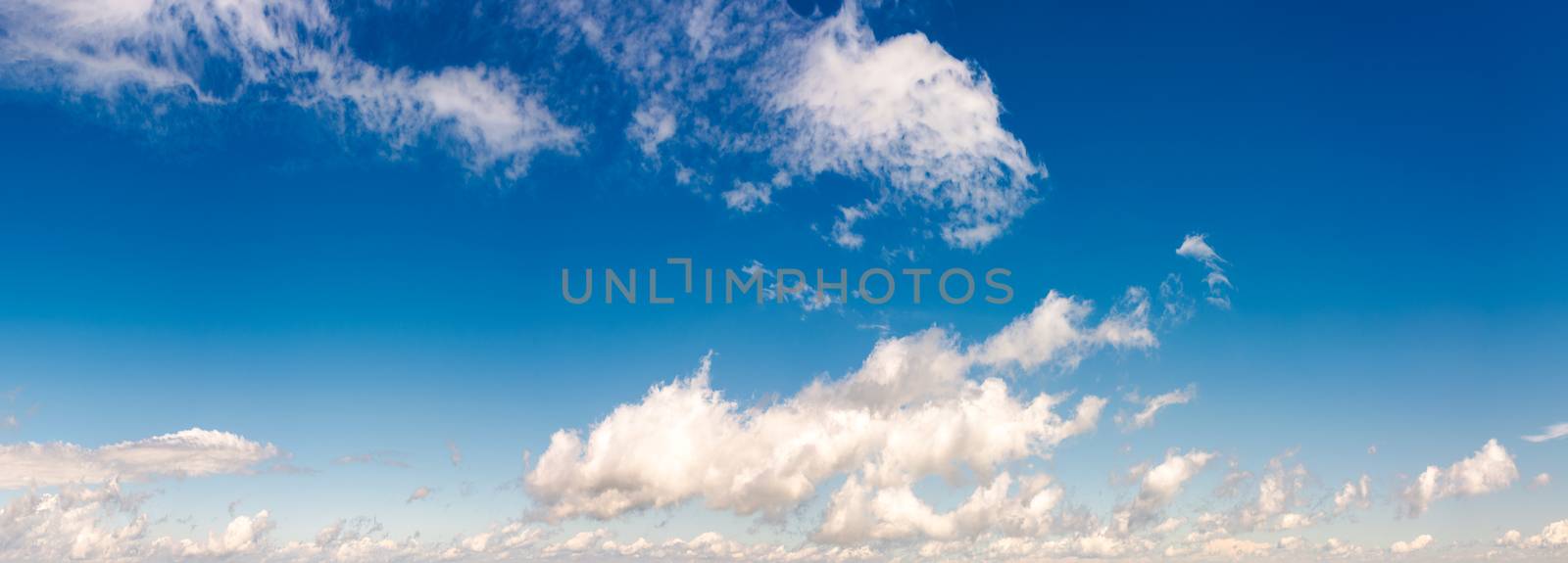 panorama of beautiful cloudscape on a blue sky. wonderful summer weather background