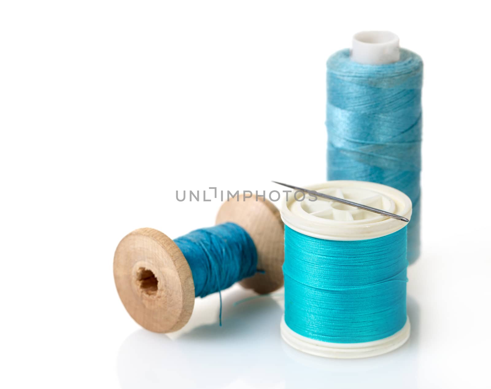 spool of blue threads  by MegaArt