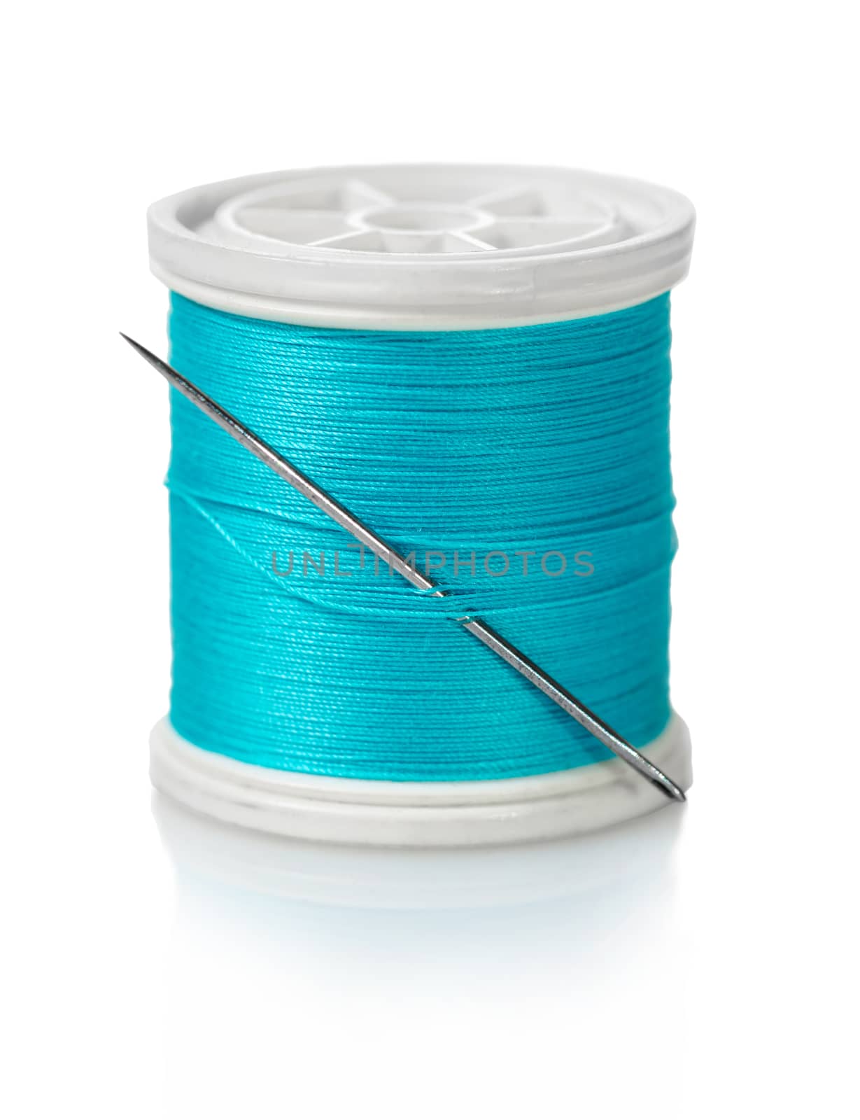 spool of blue threads on a white isolated background