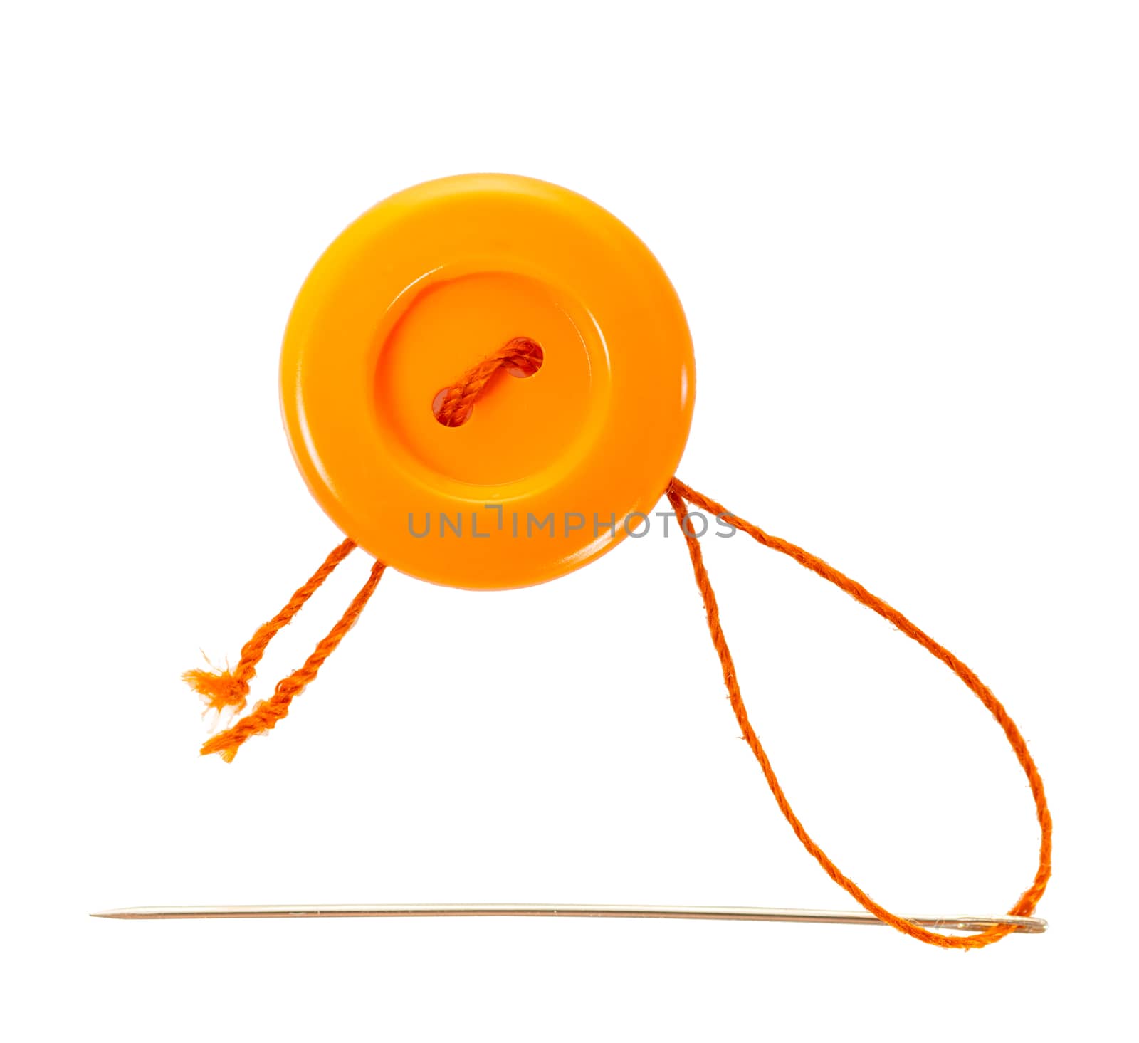 orange button with thread and needle on white isolated background