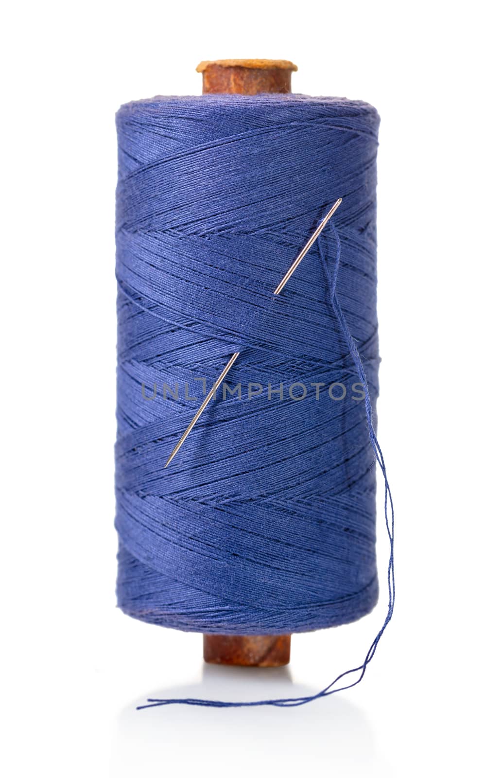 spool of purple threads on a white isolated background