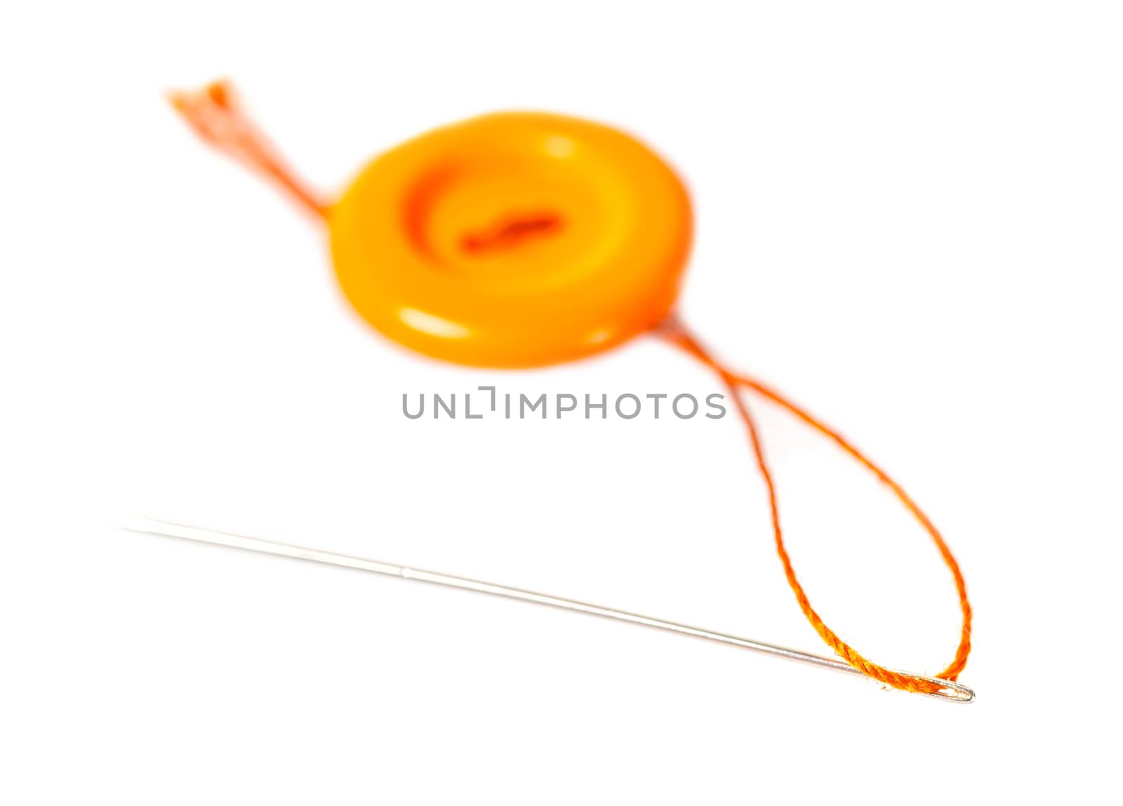 orange button with thread and needle  by MegaArt