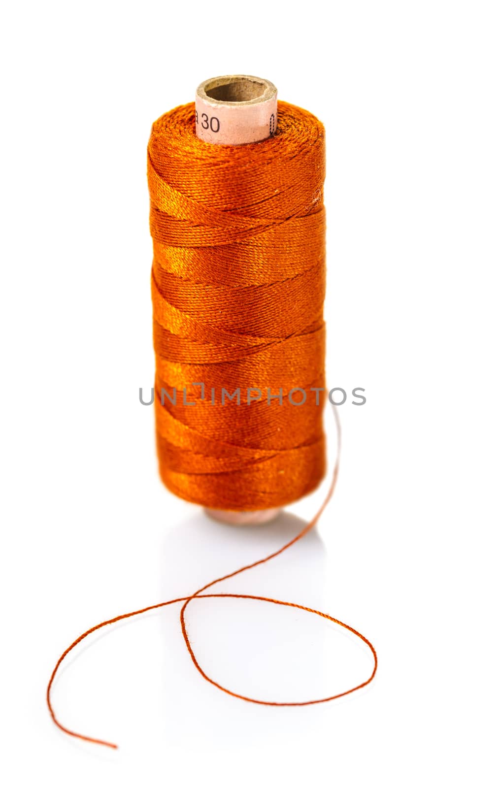 spool of orange threads  by MegaArt