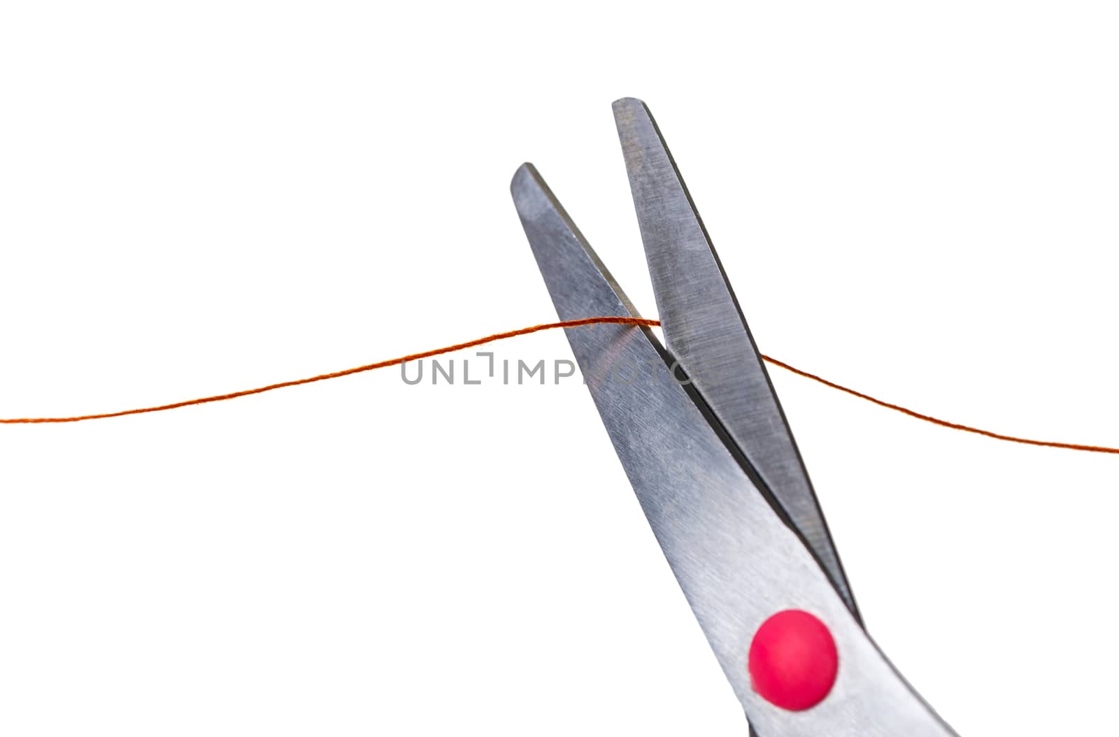 scissors cut the thread on a white isolated background
