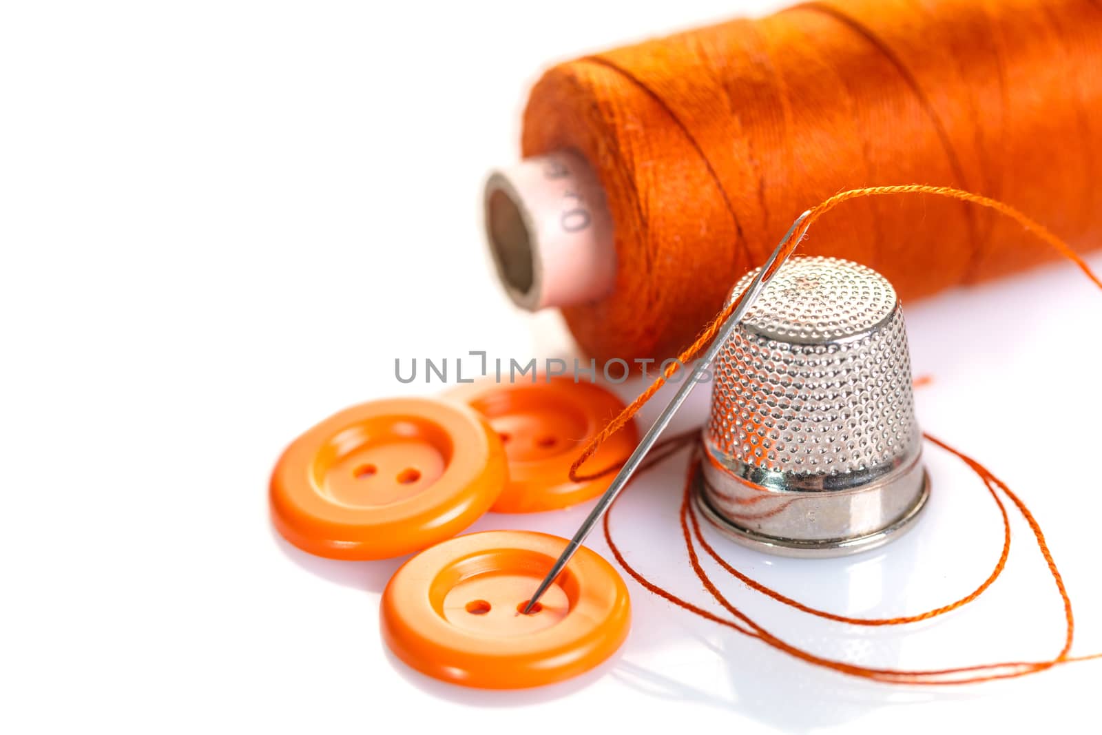 Needle with orange thread and buttons  by MegaArt