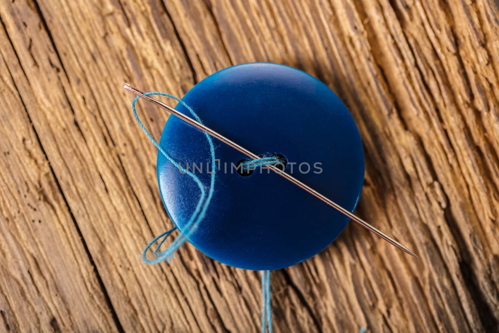 blue button with needle  by MegaArt