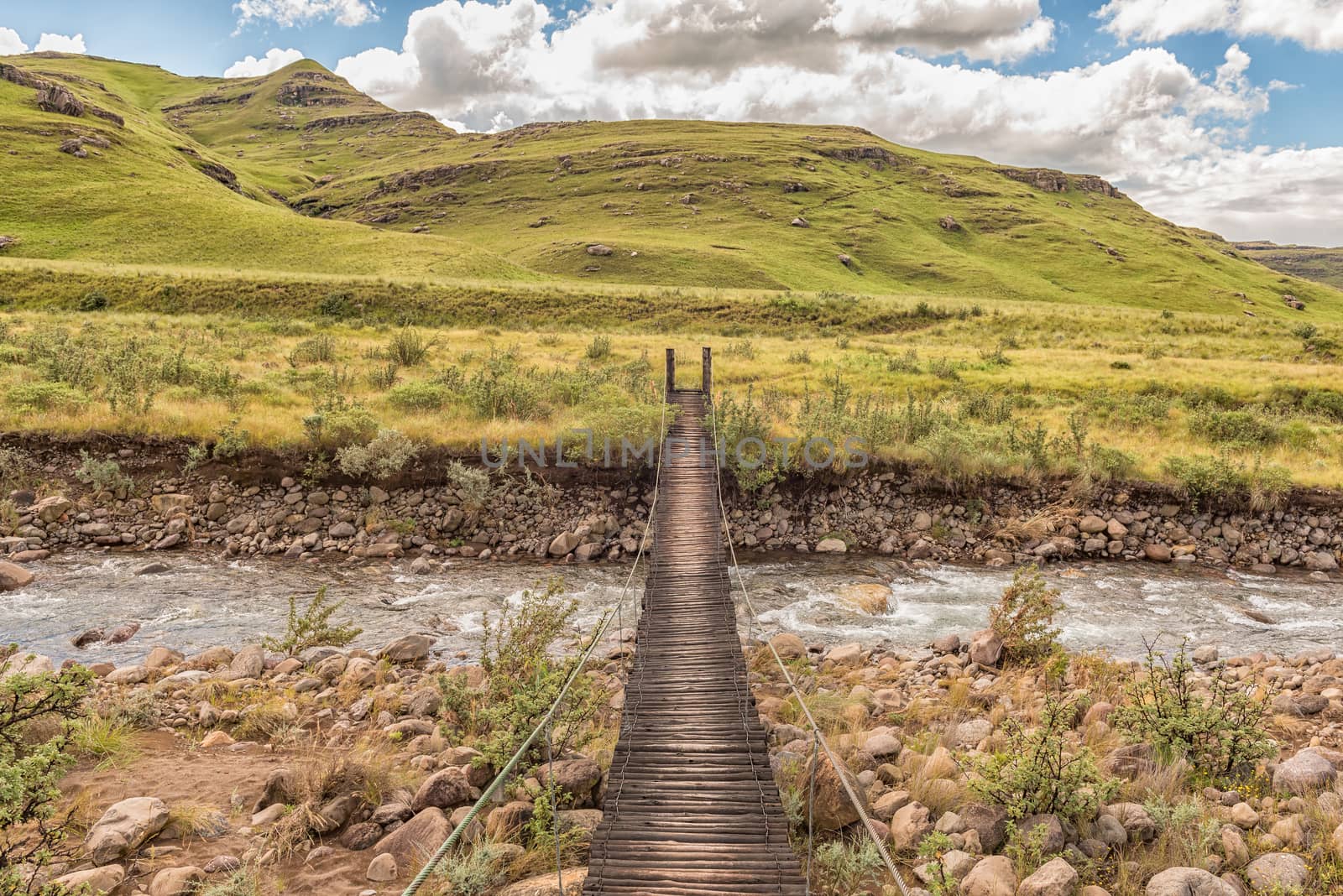 Pedestrian bridge over the Mlambonja River at the start of the Three Pools hiking trail at Garden Castle in the Drakensberg