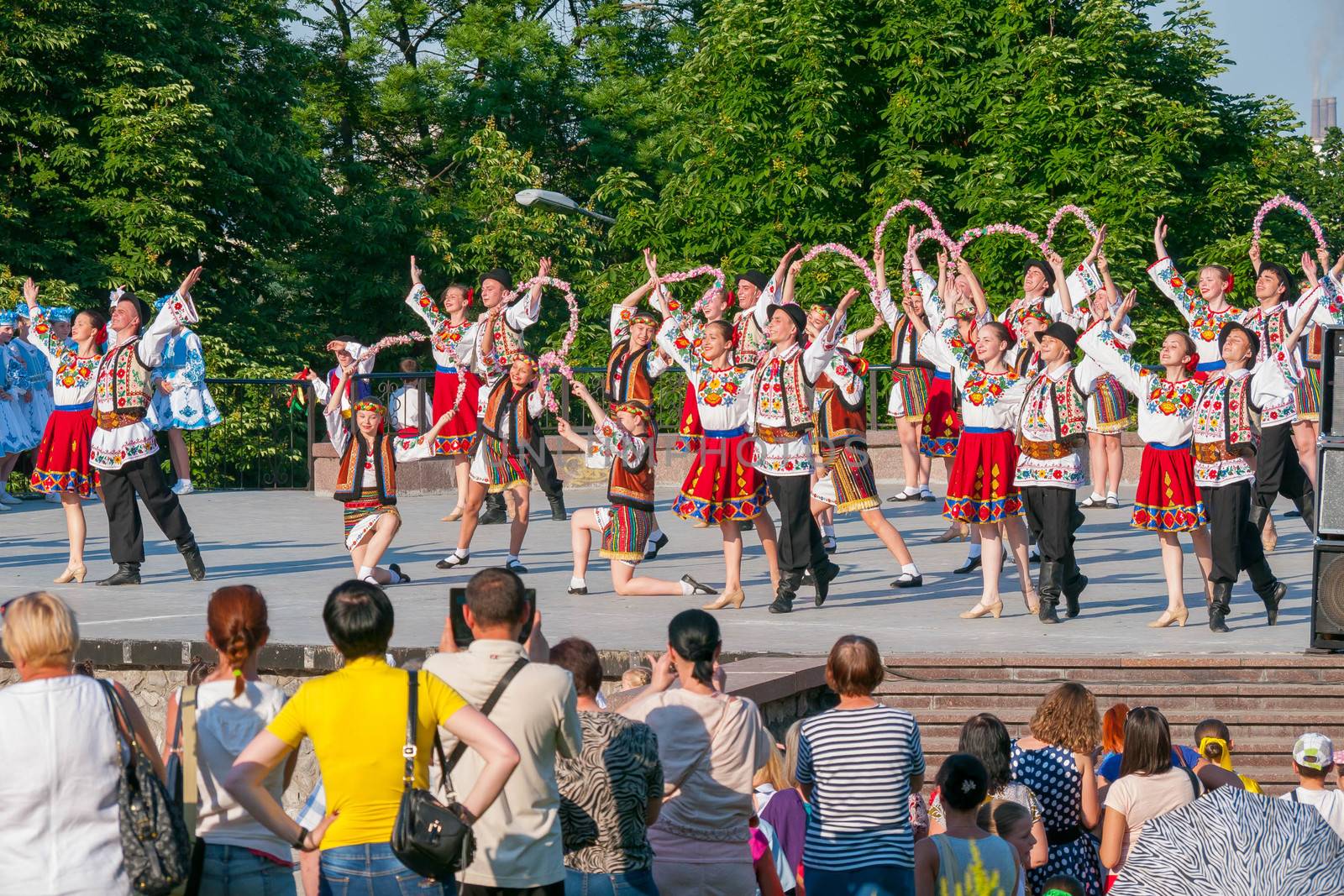 KIEV, UKRAINE - July 22 , 2016: Ukraina School of Dance Ensemble girls and boys dressed in traditional red Ukrainian embroidered costume clothes dancing