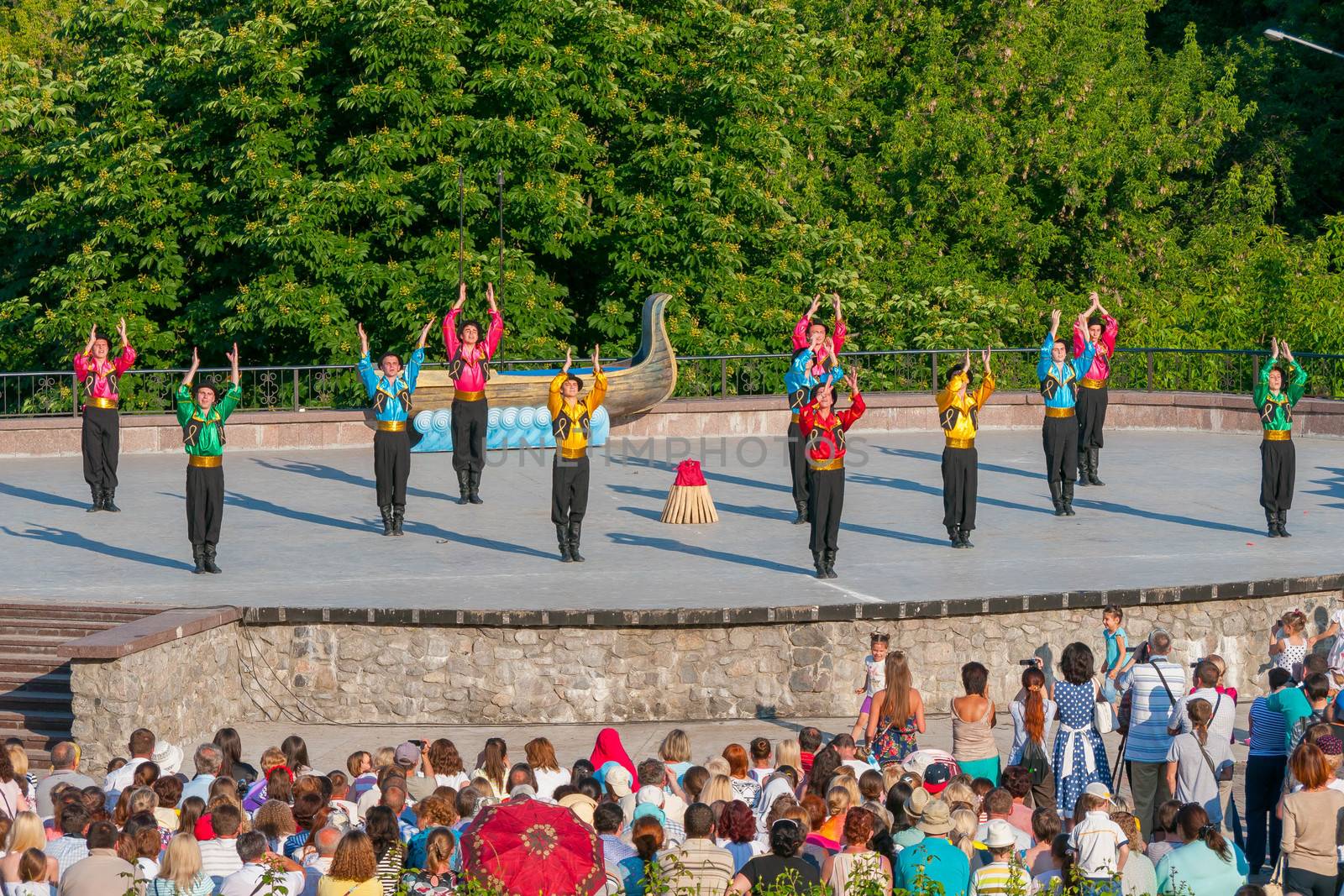 KIEV, UKRAINE - July 22 , 2016: Ukraina School of Dance Ensemble girls and boys dressed in traditional red Ukrainian embroidered costume clothes dancing