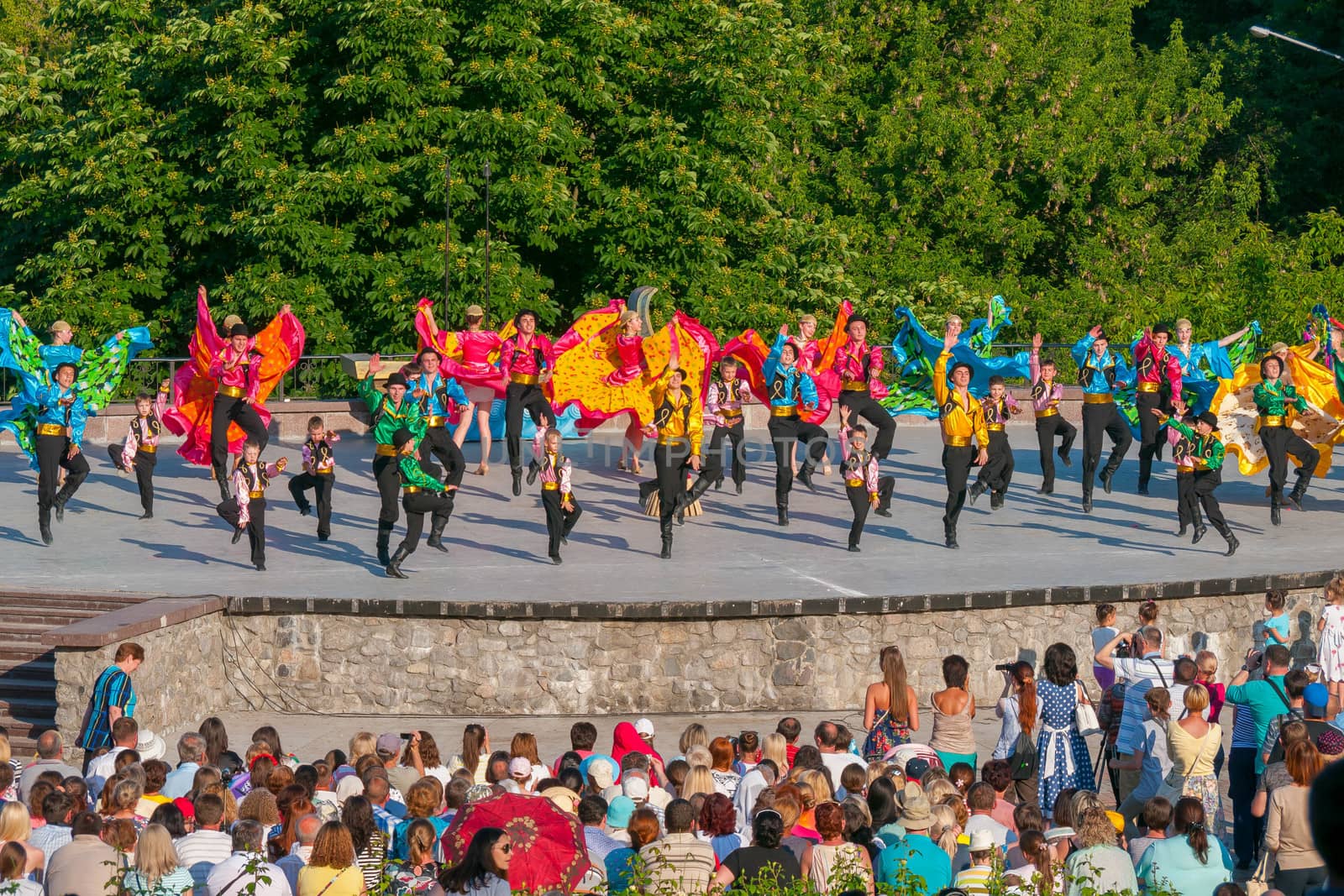 KIEV, UKRAINE - July 22 , 2016: Ukraina School of Dance Ensemble girls and boys dressed in traditional red Ukrainian embroidered costume clothes dancing