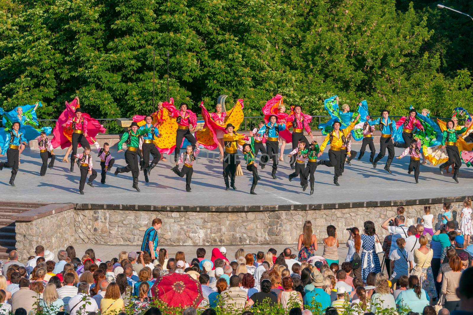 KIEV, UKRAINE - July 22 , 2016: Ukraina School of Dance Ensemble girls and boys dressed in traditional red Ukrainian embroidered costume clothes dancing