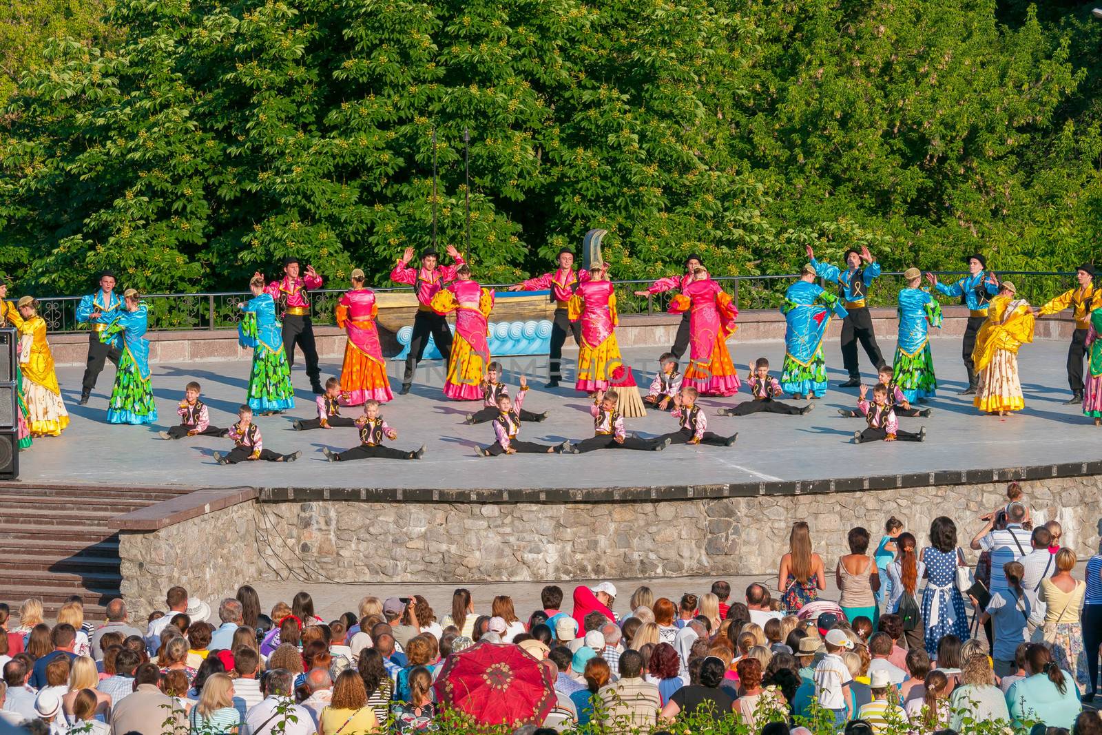 KIEV, UKRAINE - July 22 , 2016: Ukraina School of Dance Ensemble girls and boys dressed in traditional red Ukrainian embroidered costume clothes dancing