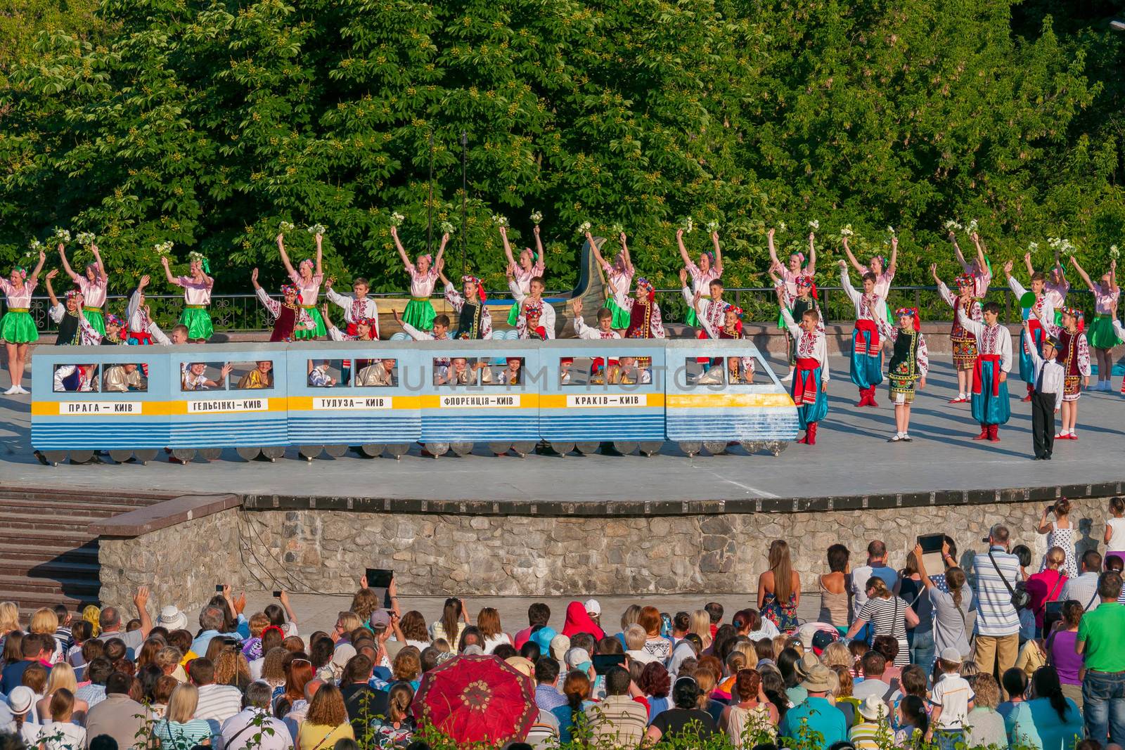 KIEV, UKRAINE - July 22 , 2016: Ukraina School of Dance Ensemble girls and boys dressed in traditional red Ukrainian embroidered costume clothes dancing