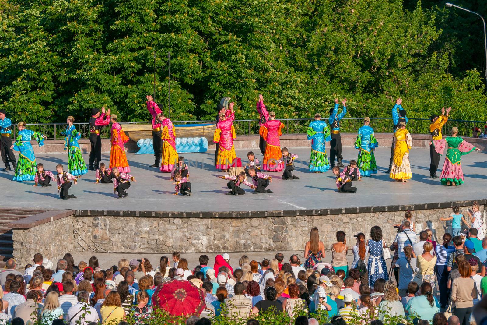 KIEV, UKRAINE - July 22 , 2016: Ukraina School of Dance Ensemble girls and boys dressed in traditional red Ukrainian embroidered costume clothes dancing