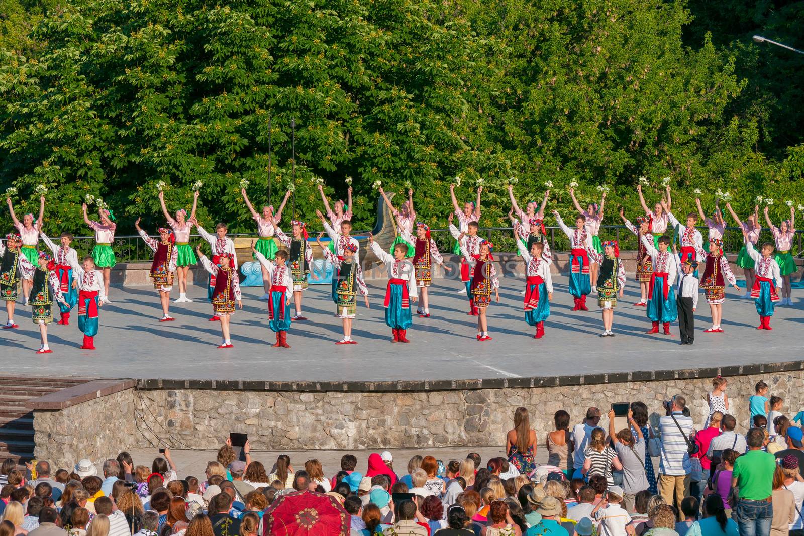 KIEV, UKRAINE - July 22 , 2016: Ukraina School of Dance Ensemble girls and boys dressed in traditional red Ukrainian embroidered costume clothes dancing