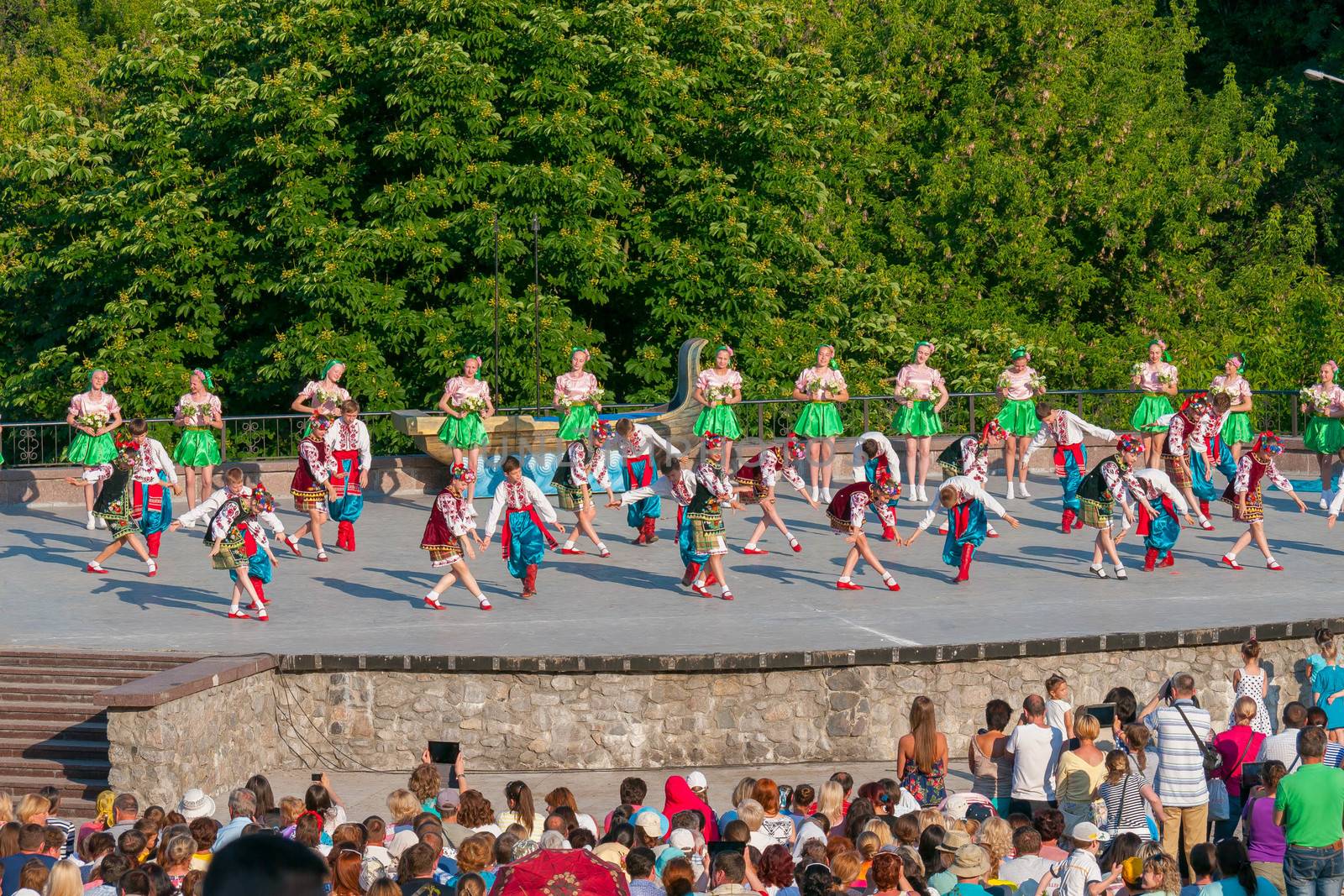 KIEV, UKRAINE - July 22 , 2016: Ukraina School of Dance Ensemble girls and boys dressed in traditional red Ukrainian embroidered costume clothes dancing