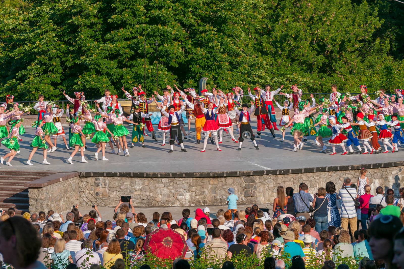 KIEV, UKRAINE - July 22 , 2016: Ukraina School of Dance Ensemble girls and boys dressed in traditional red Ukrainian embroidered costume clothes dancing
