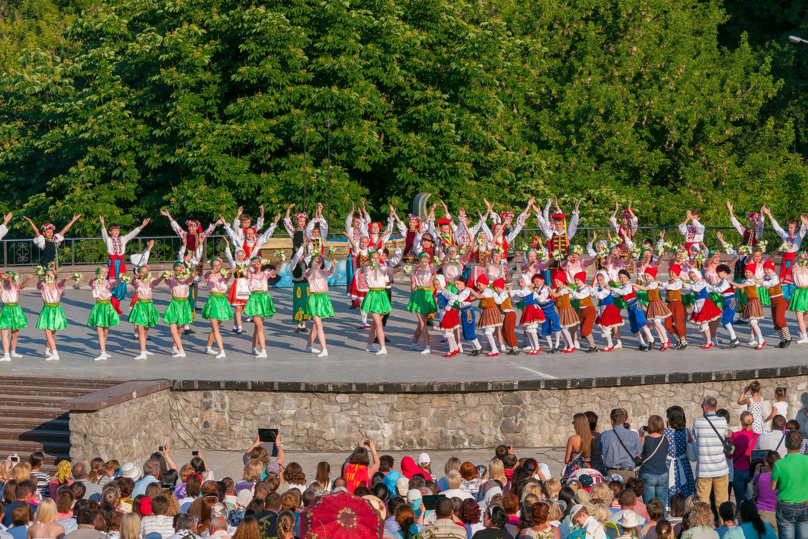 KIEV, UKRAINE - July 22 , 2016: Ukraina School of Dance Ensemble girls and boys dressed in traditional red Ukrainian embroidered costume clothes dancing