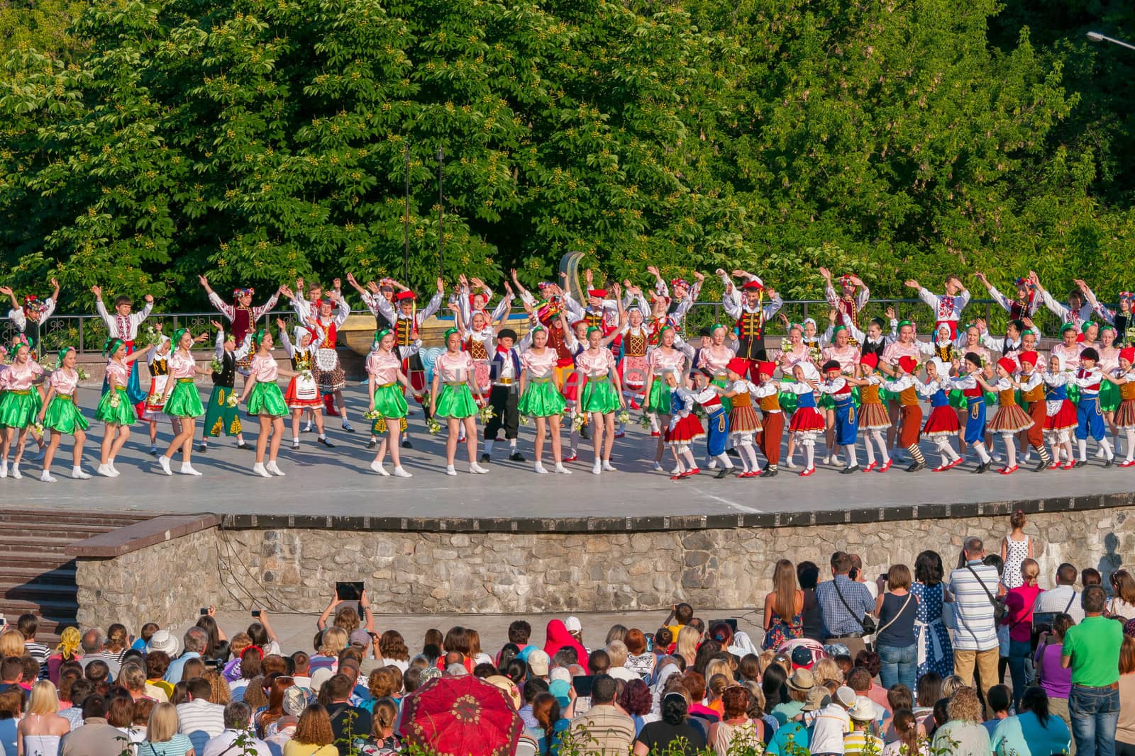 KIEV, UKRAINE - July 22 , 2016: Ukraina School of Dance Ensemble girls and boys dressed in traditional red Ukrainian embroidered costume clothes dancing