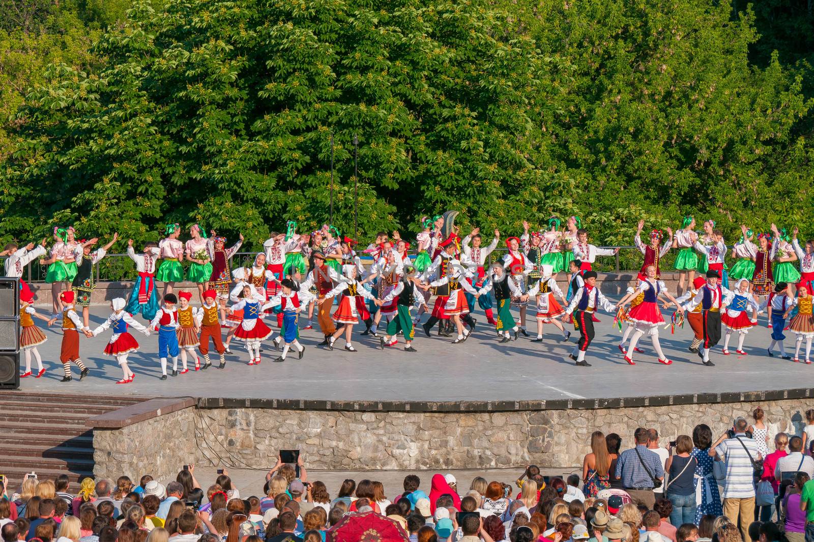 KIEV, UKRAINE - July 22 , 2016: Ukraina School of Dance Ensemble girls and boys dressed in traditional red Ukrainian embroidered costume clothes dancing