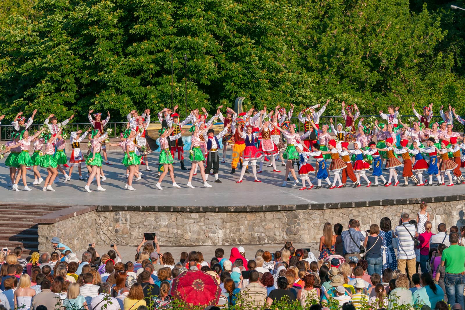 KIEV, UKRAINE - July 22 , 2016: Ukraina School of Dance Ensemble girls and boys dressed in traditional red Ukrainian embroidered costume clothes dancing