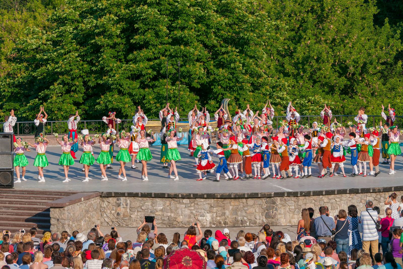 KIEV, UKRAINE - July 22 , 2016: Ukraina School of Dance Ensemble girls and boys dressed in traditional red Ukrainian embroidered costume clothes dancing