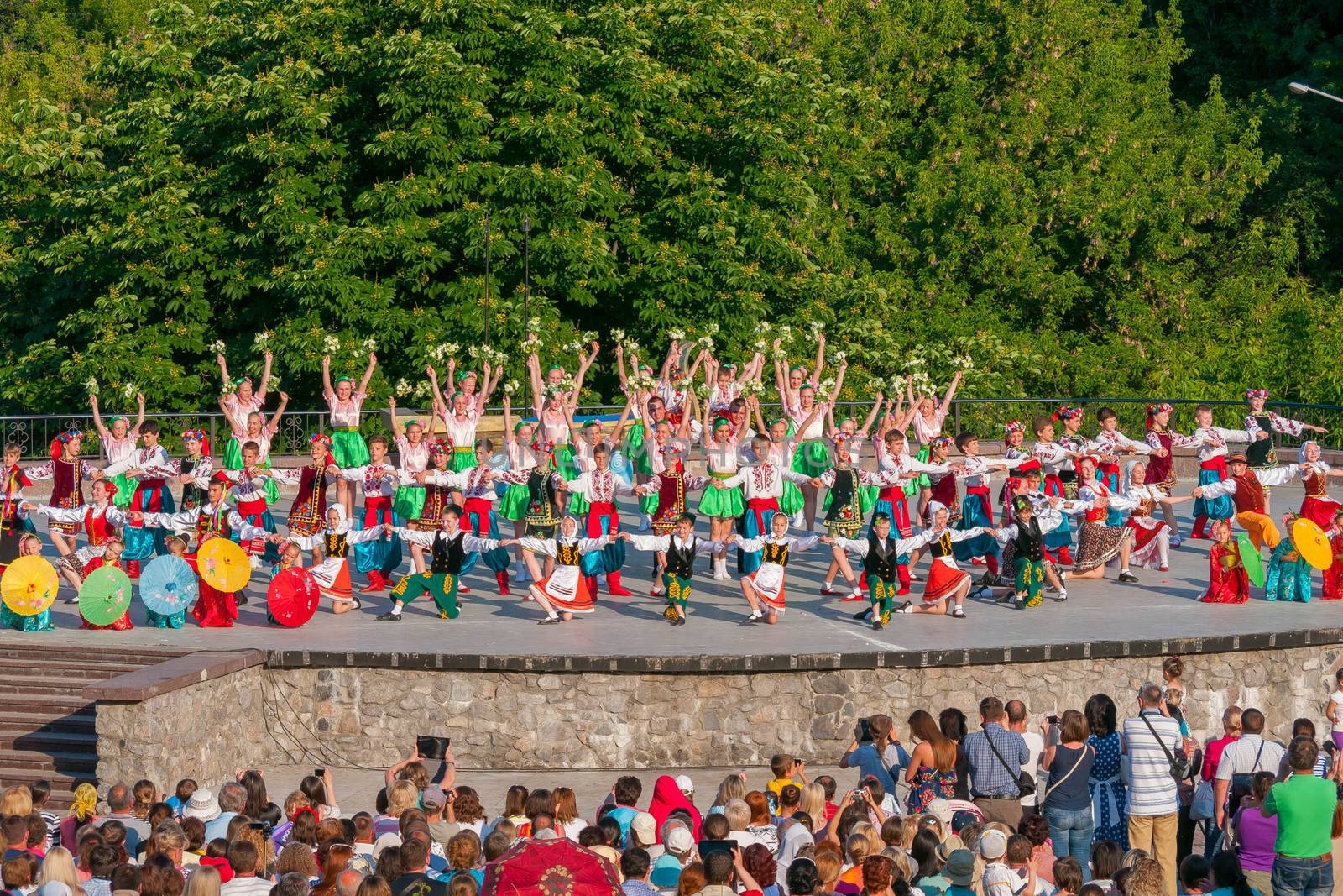 KIEV, UKRAINE - July 22 , 2016: Ukraina School of Dance Ensemble girls and boys dressed in traditional red Ukrainian embroidered costume clothes dancing
