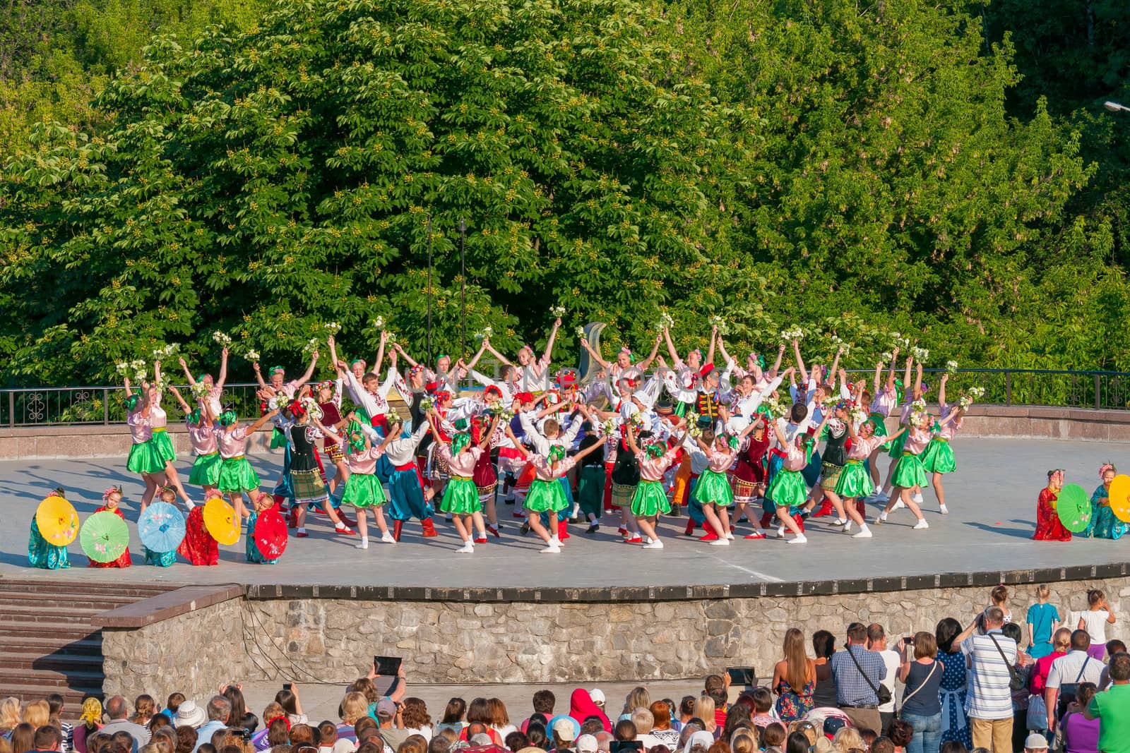 KIEV, UKRAINE - July 22 , 2016: Ukraina School of Dance Ensemble girls and boys dressed in traditional red Ukrainian embroidered costume clothes dancing