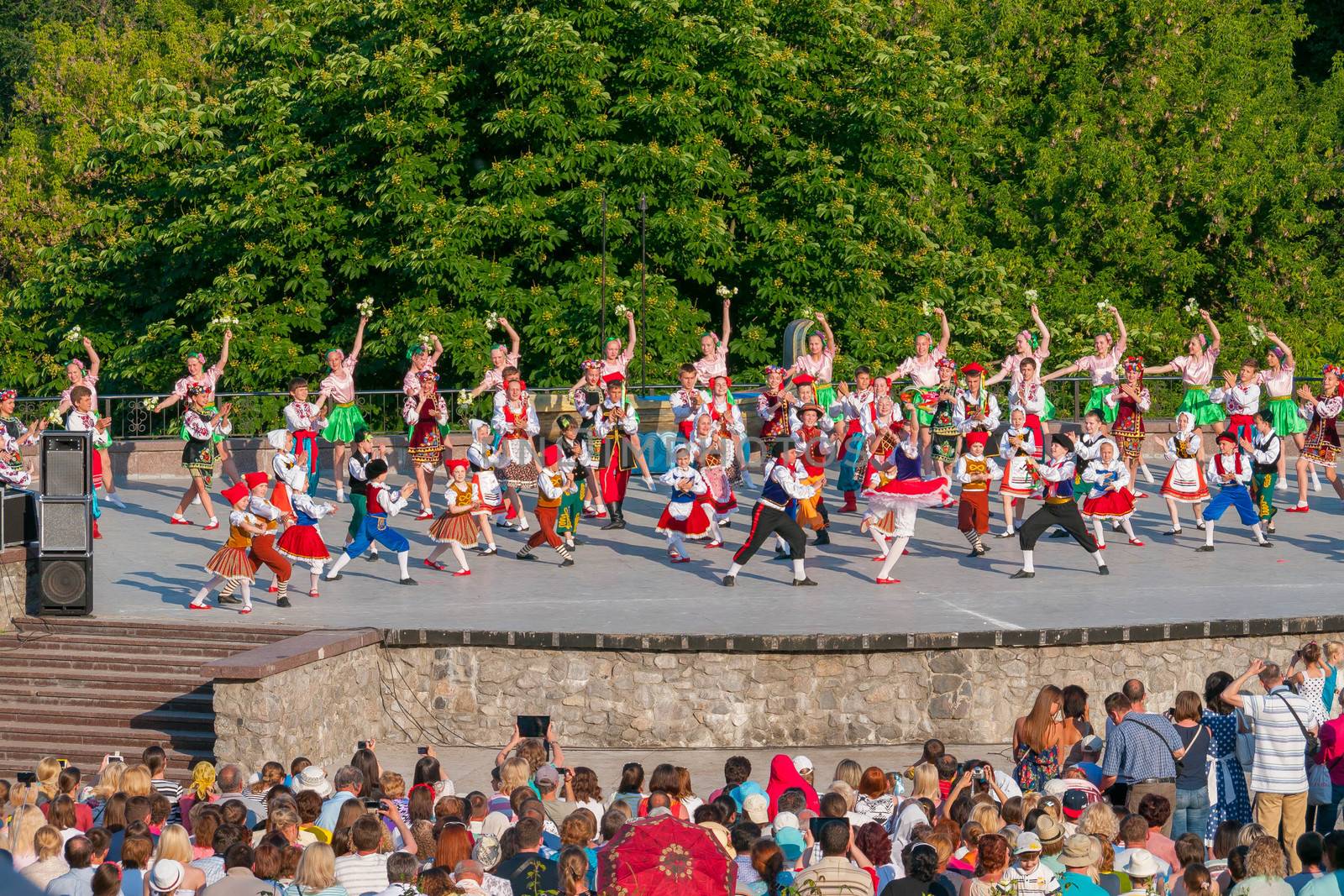 KIEV, UKRAINE - July 22 , 2016: Ukraina School of Dance Ensemble girls and boys dressed in traditional red Ukrainian embroidered costume clothes dancing