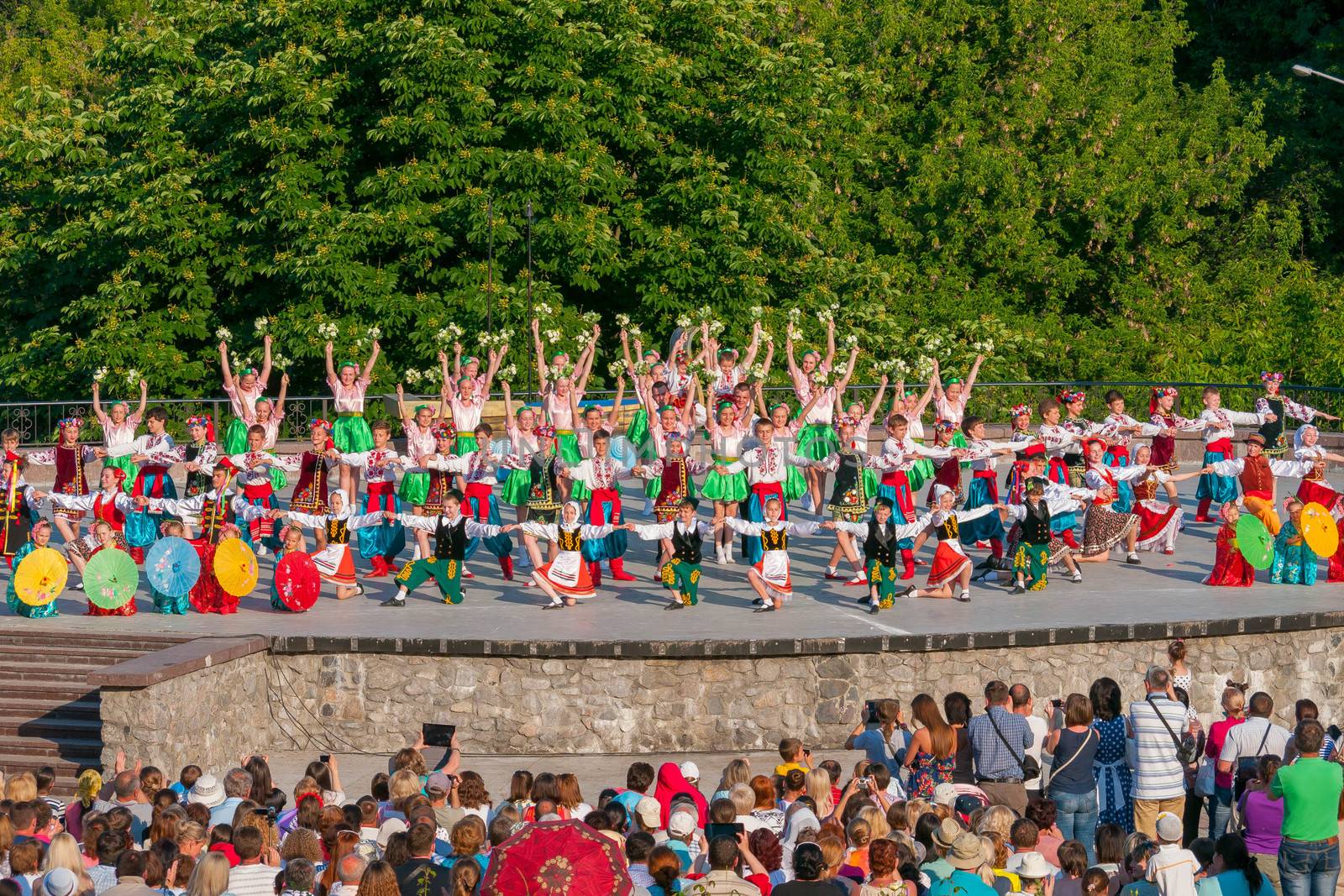 KIEV, UKRAINE - July 22 , 2016: Ukraina School of Dance Ensemble girls and boys dressed in traditional red Ukrainian embroidered costume clothes dancing