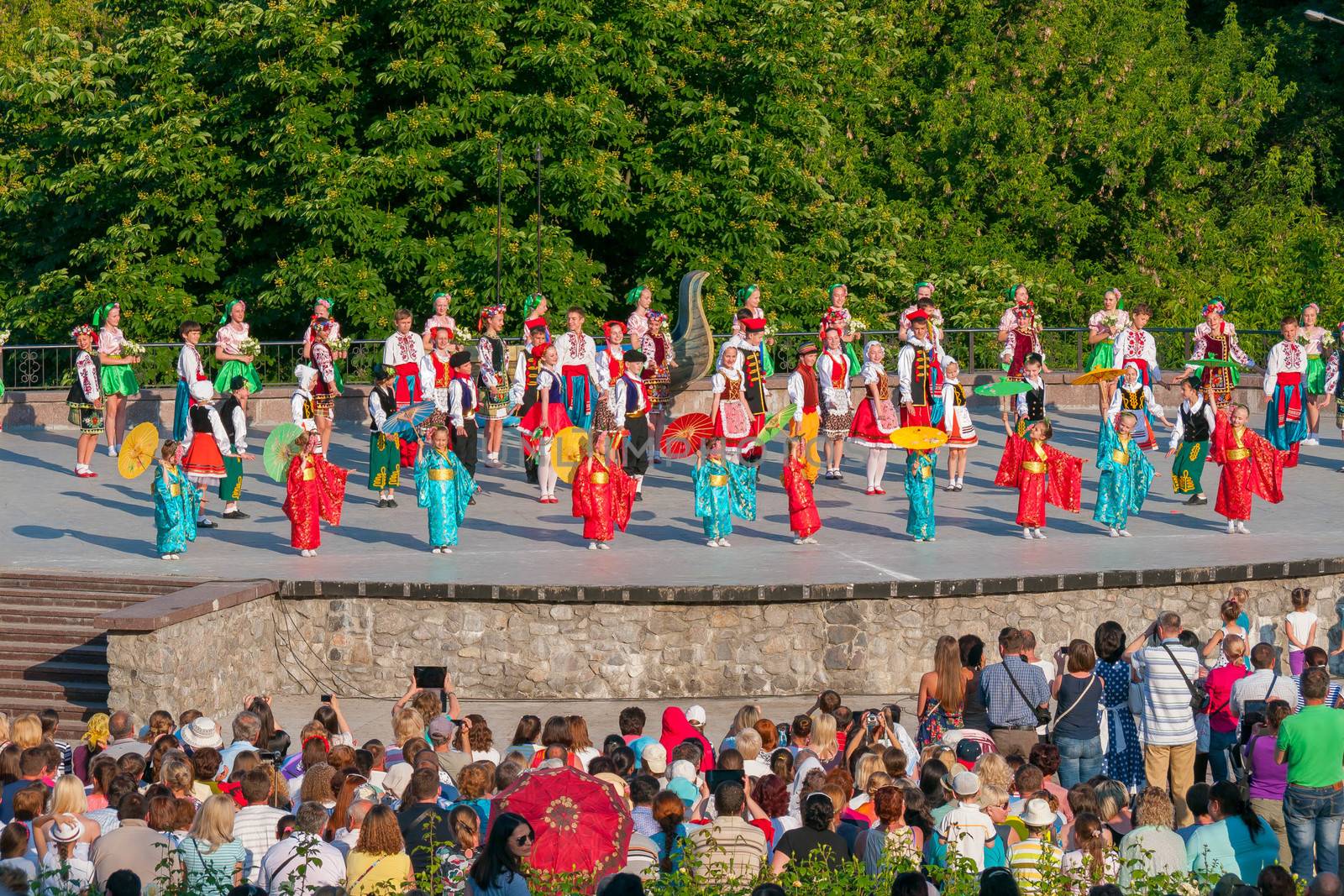 KIEV, UKRAINE - July 22 , 2016: Ukraina School of Dance Ensemble girls and boys dressed in traditional red Ukrainian embroidered costume clothes dancing